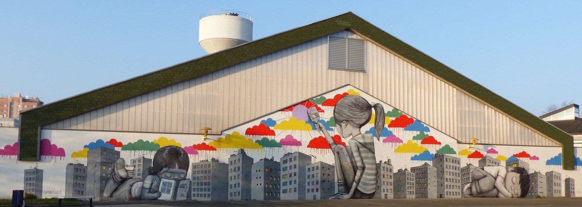 Children with colorful clouds — Street art by Seth in Fleury-les-Aubrais