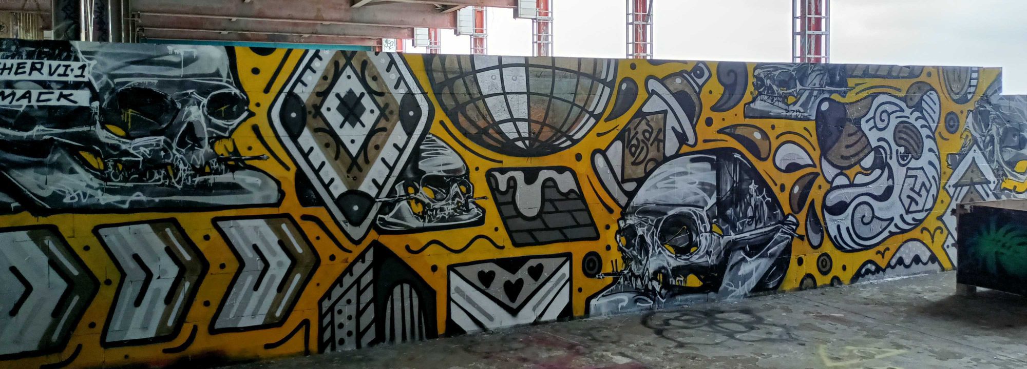 Skulls and Tribal Patterns on Golden Background — Street art by Chervi.1 in Berlin