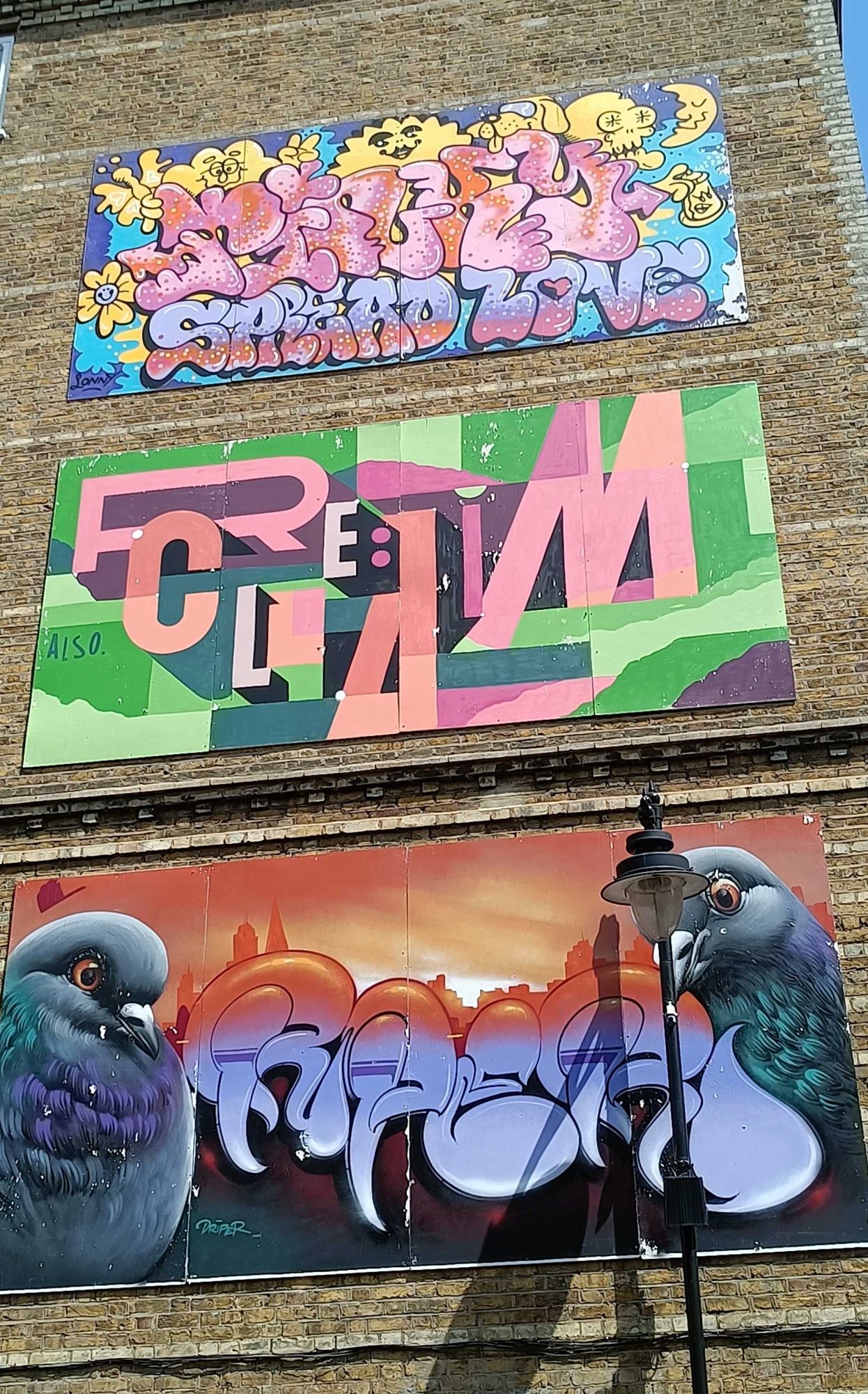 Three panels and two pigeons — Street art in London