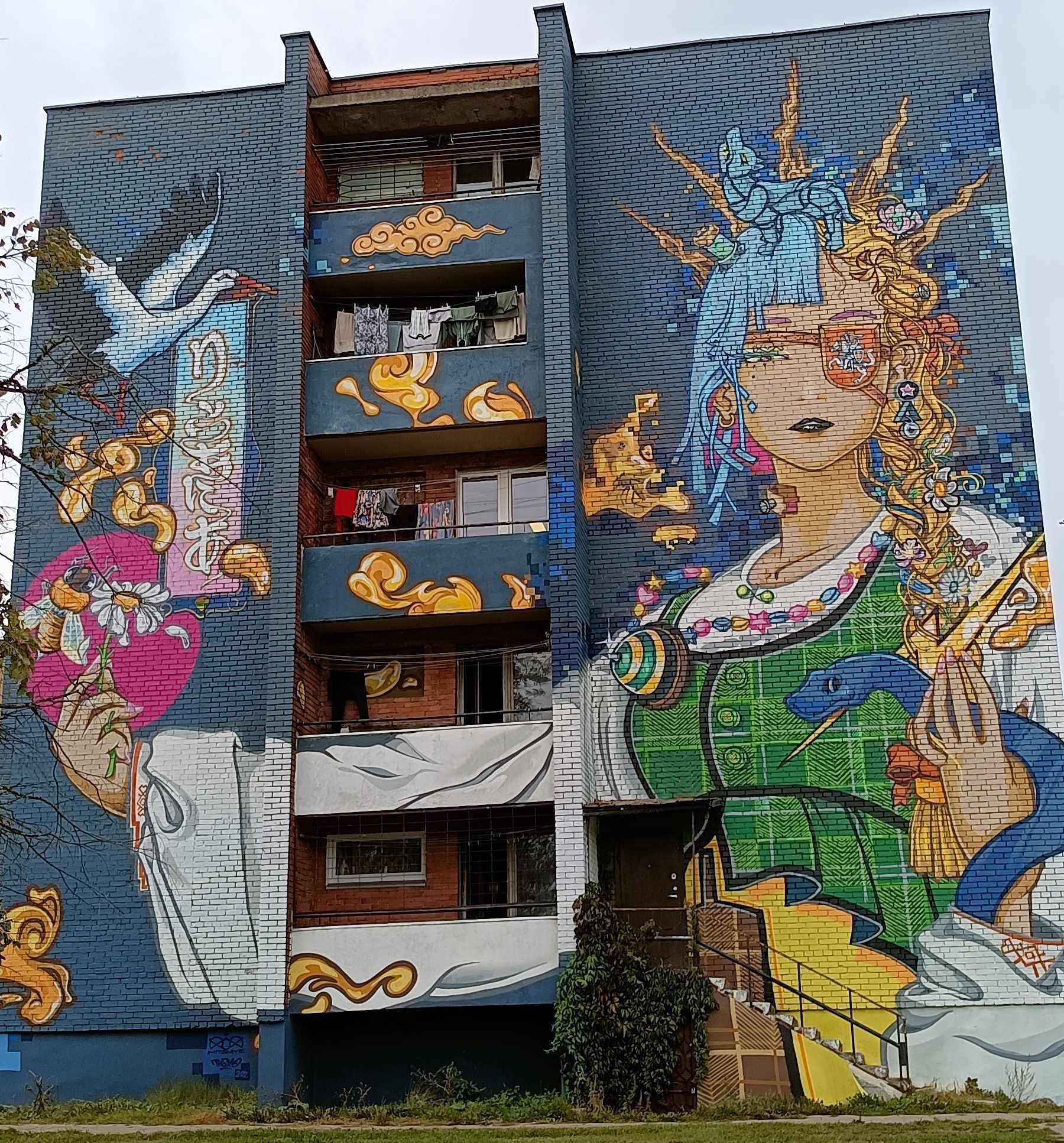 Golden woman in baroque ornament — Street art by Kipras Petrulis, Hiroyuki Mitsume Takahashi in Vilnius