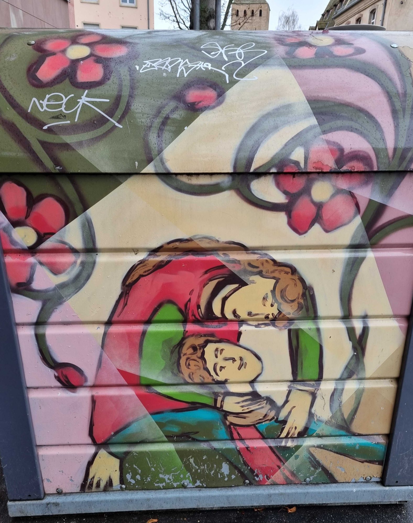 Two Embracing Figures and Red Flowers — Street art in Strasbourg