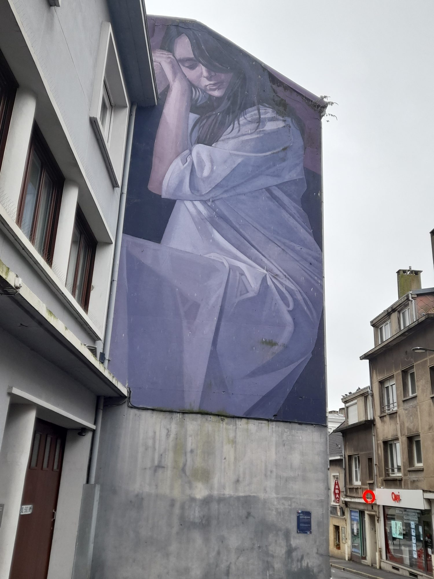 The Large Figure Draped in Blue — Street art by LONAC in Boulogne-sur-Mer