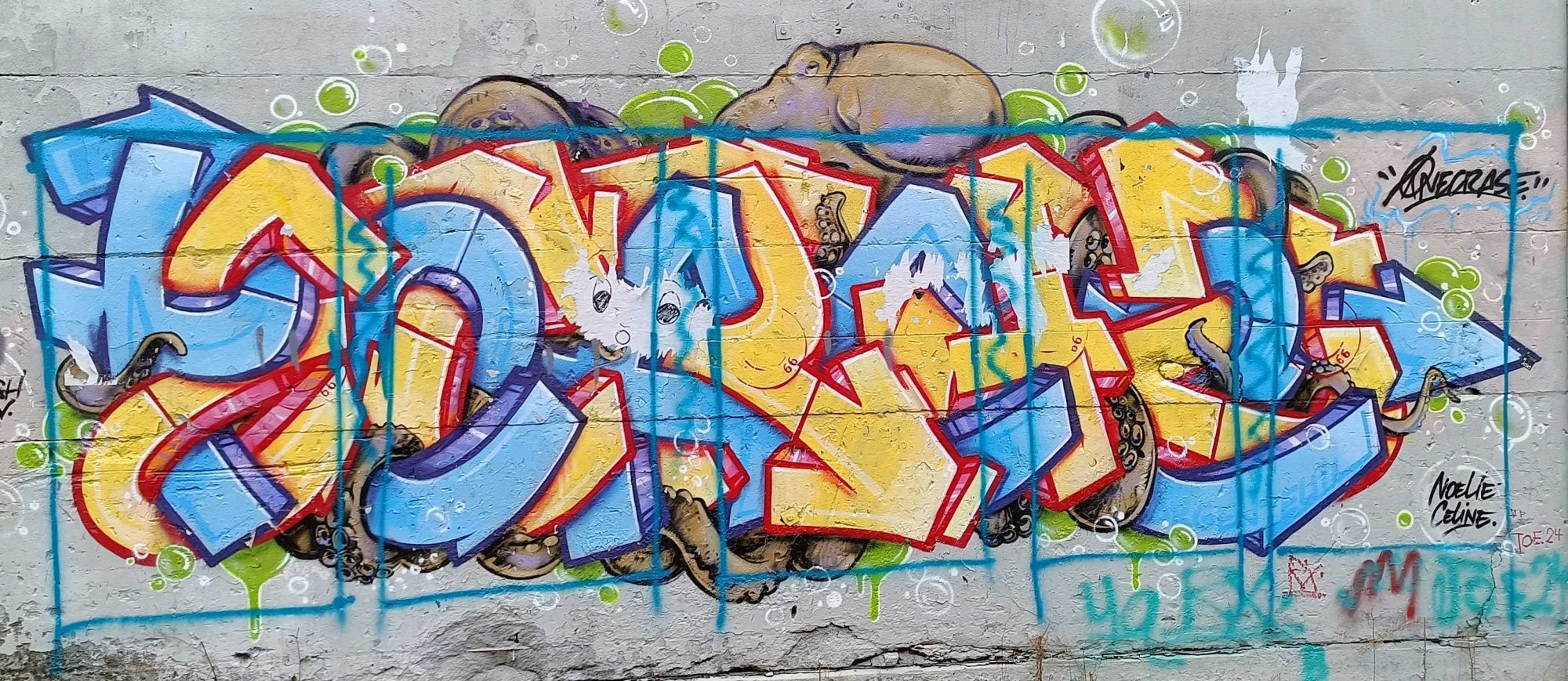 Blue and Yellow Bubble Letters Graffiti — Street art in Berlin