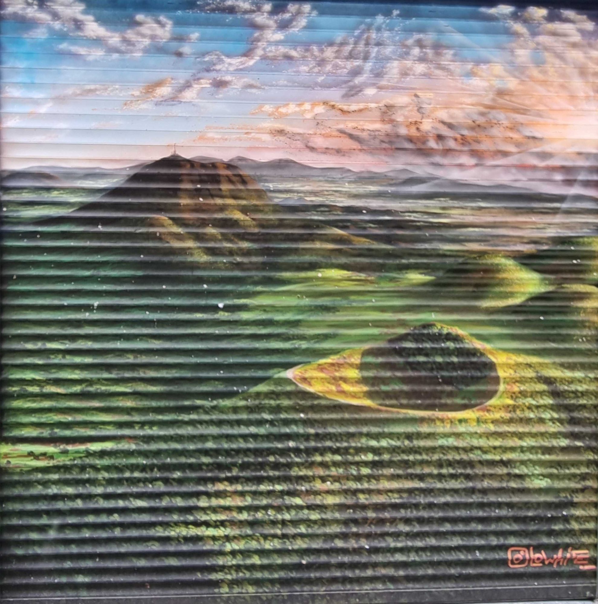 Chaîne des Puys on Metal Shutter — Street art in Clermont-Ferrand
