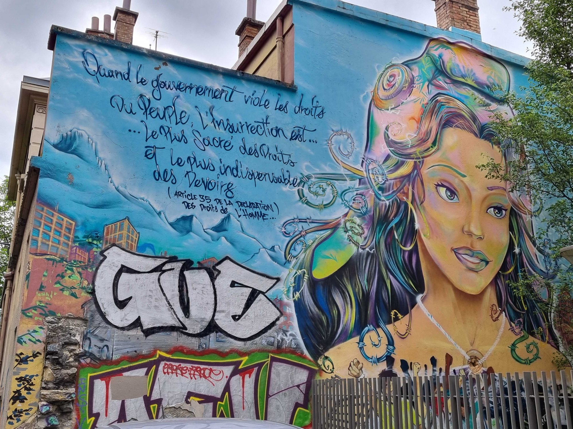 Woman Portrait and Human Rights Quote — Street art in Grenoble