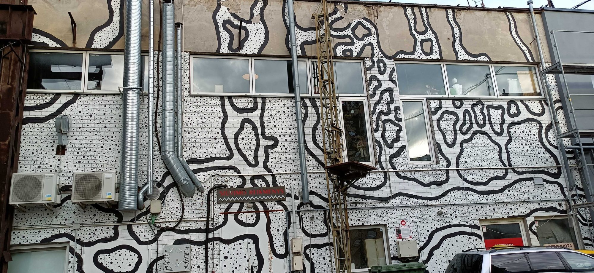 Camouflage-Patterned Facade — Street art in Vilnius