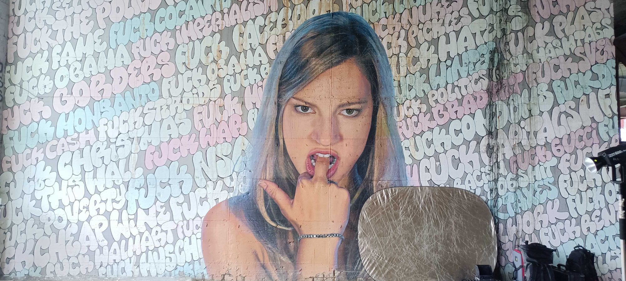 Portrait Against a Wall of FUCK — Street art by Nick Flatt, Paul Punk in Berlin