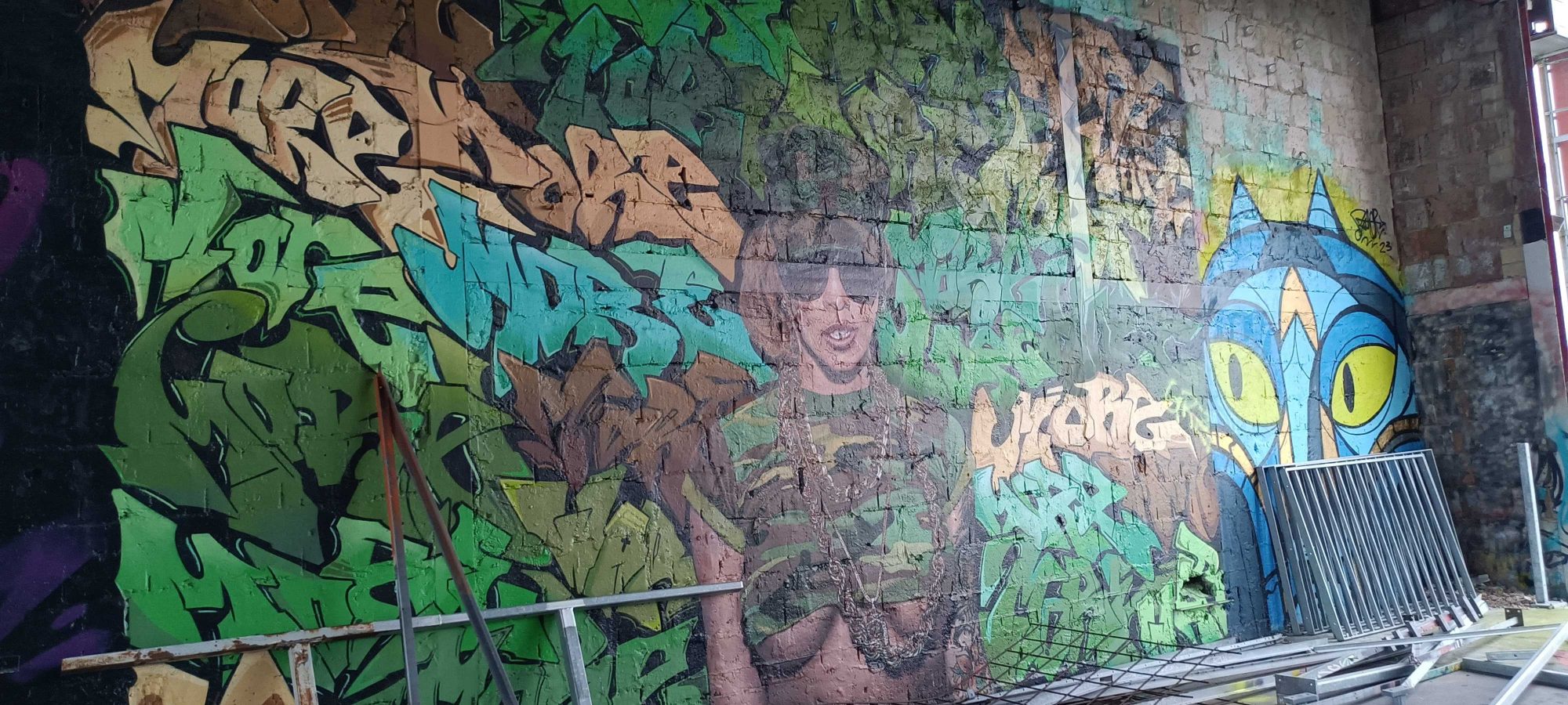 Green Wildstyle, Female Character and Blue Cat — Street art in Berlin