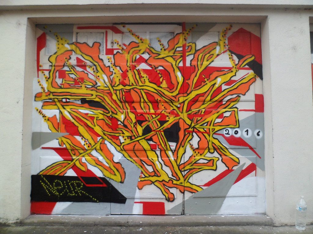 Orange and Yellow Branches — Street art in Périgueux
