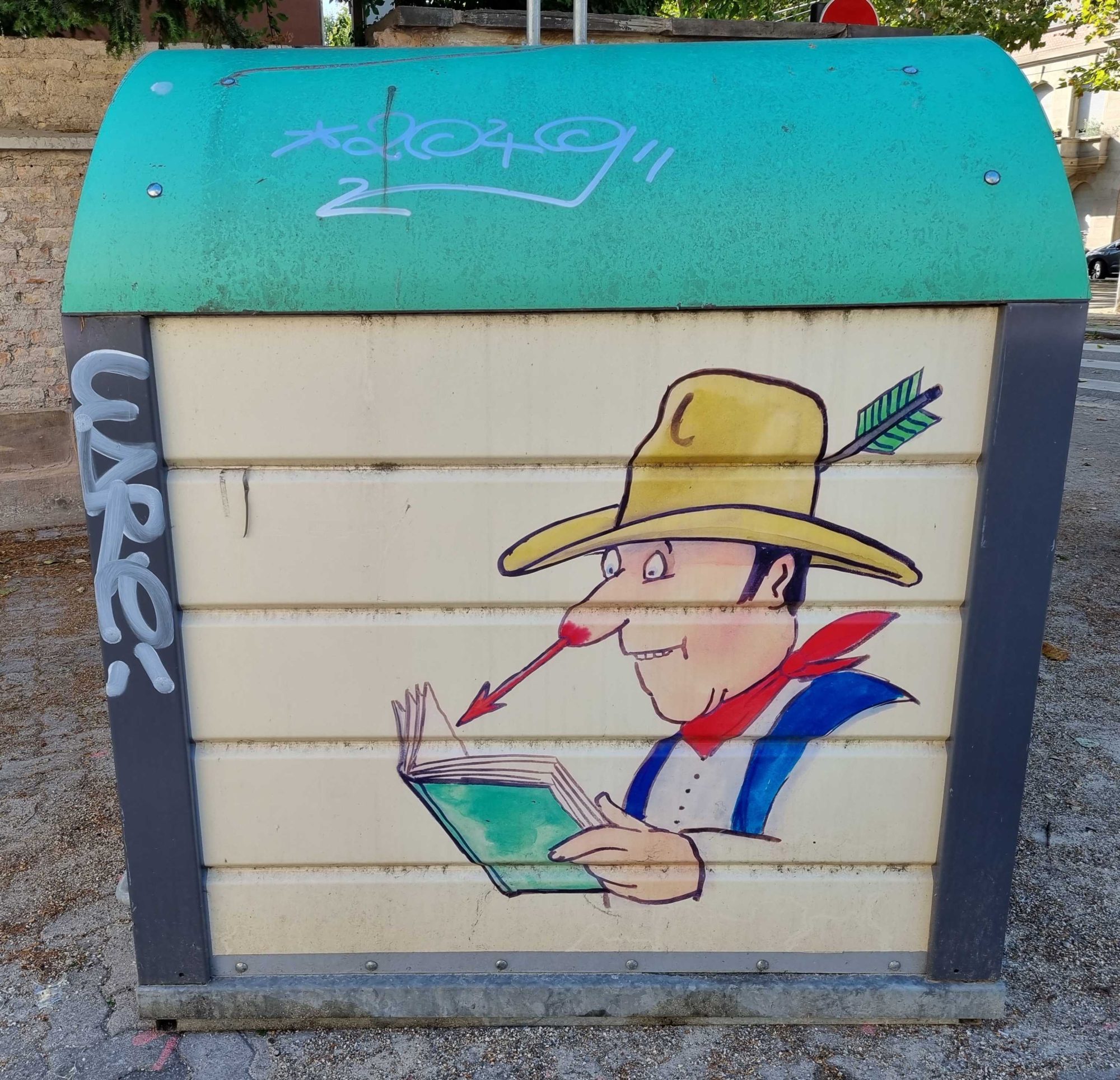 Reading cowboy pierced by an arrow — Street art in Strasbourg