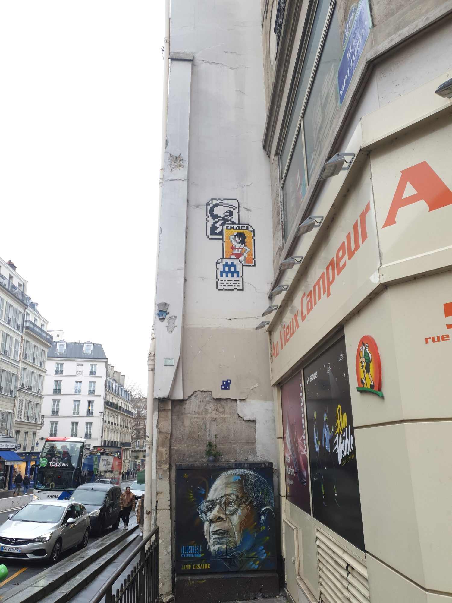 Three Stacked Mosaics — Street art by Invader, C215 in Paris
