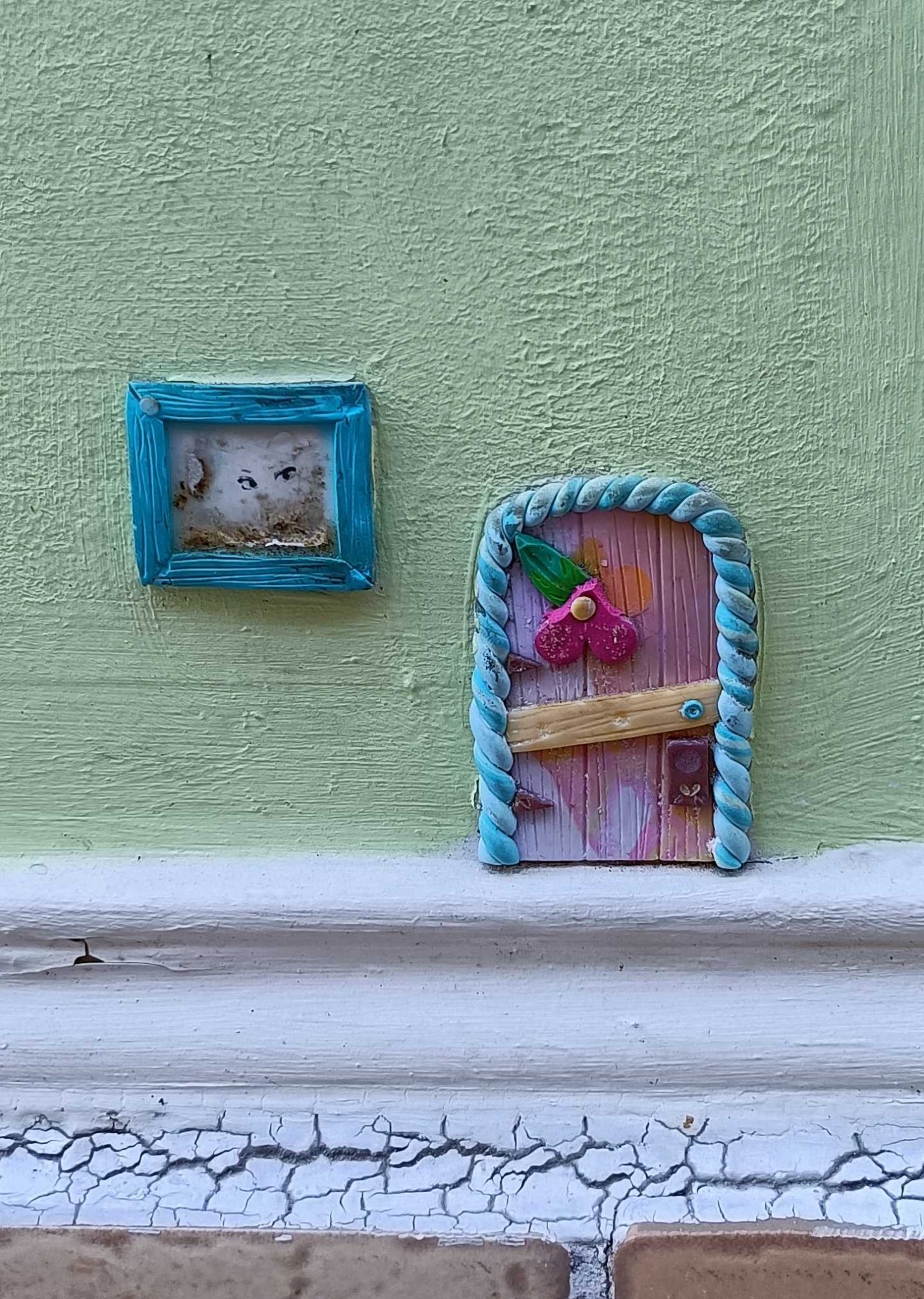 The Pink Door and the Small Turquoise Window — Street art by Florizale in Bourges