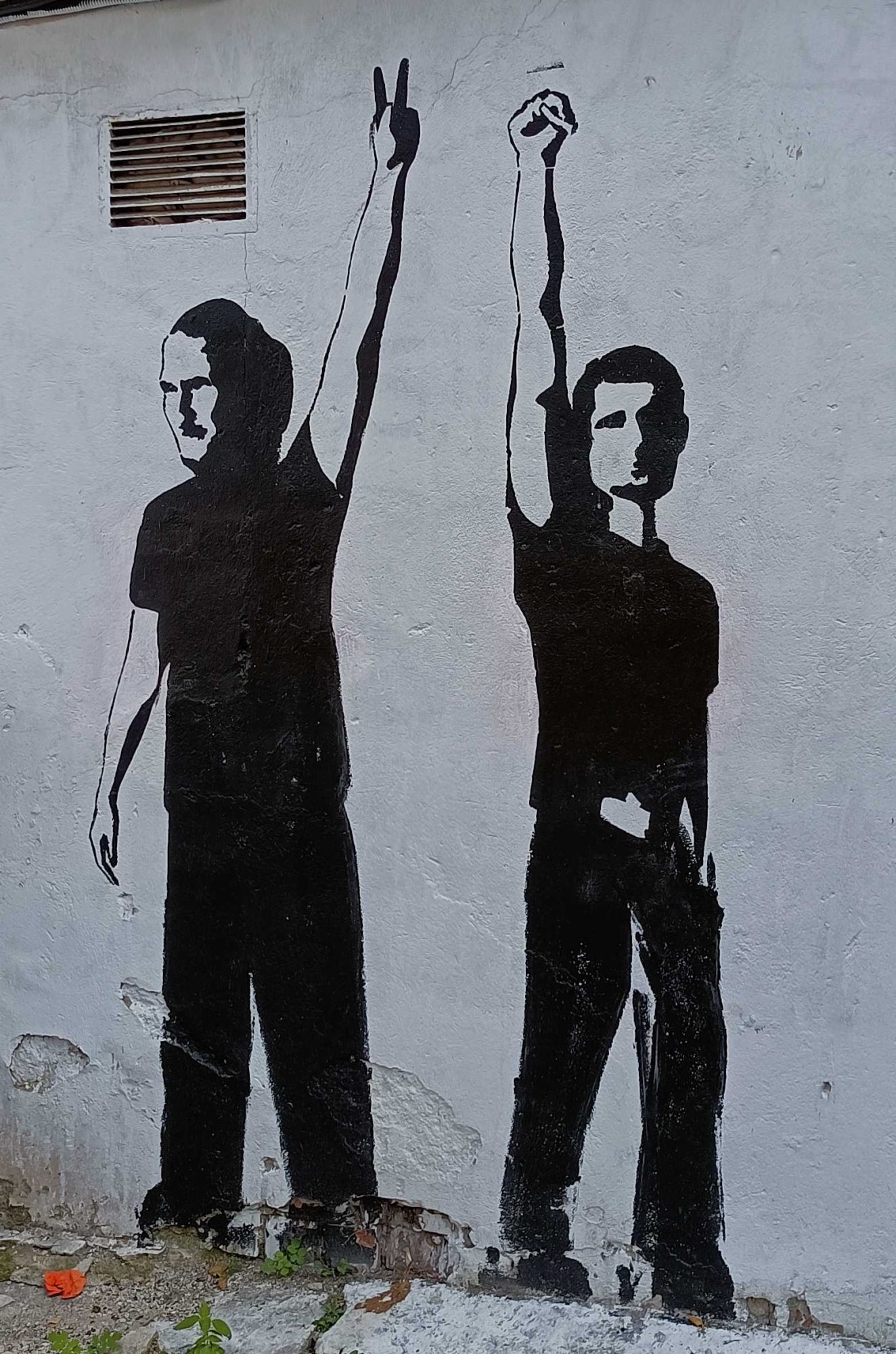 Two Silhouettes, Fist and V-Sign — Street art in Vilnius