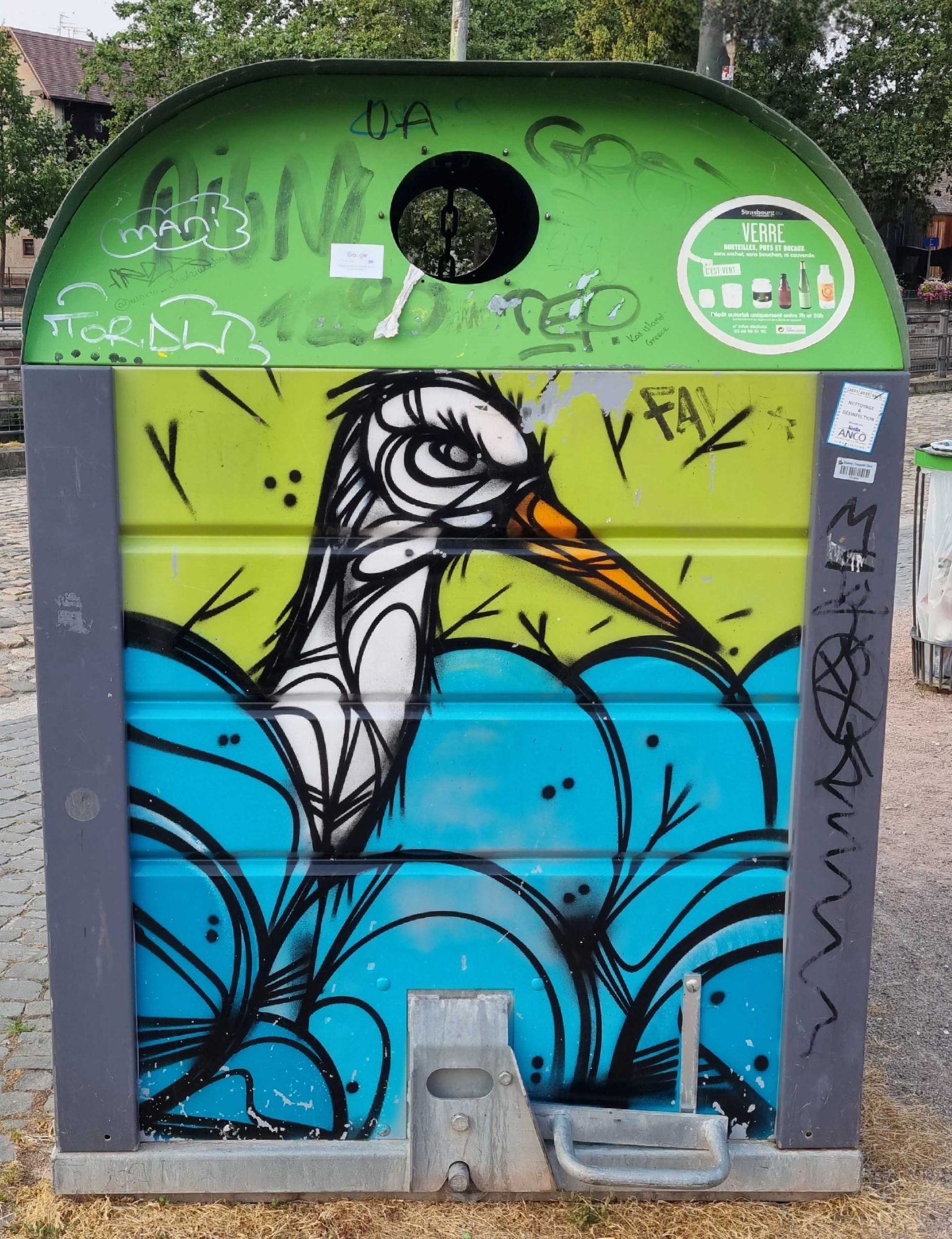 The Heron on the Glass Bin — Street art in Strasbourg