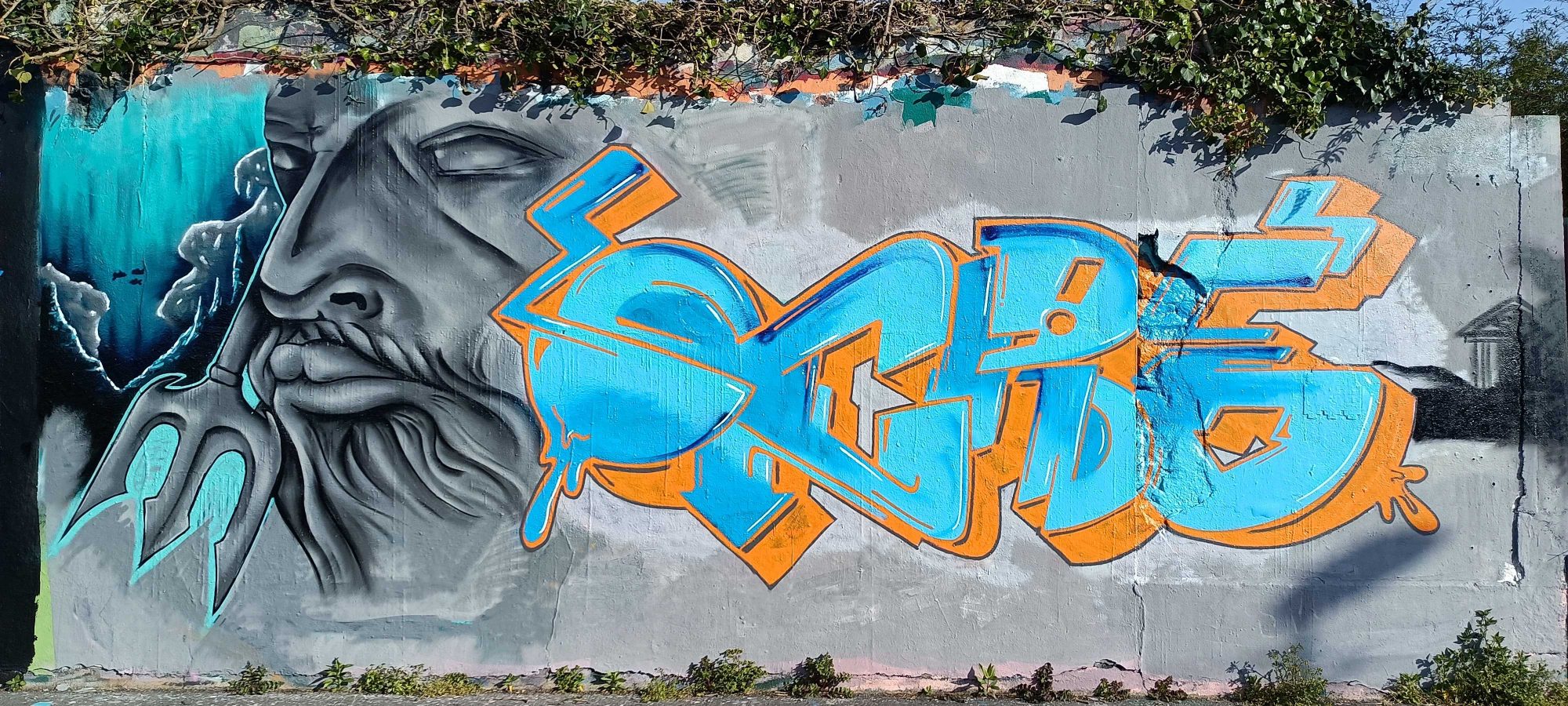 The bearded elder and the cyan lettering — Street art in Nantes