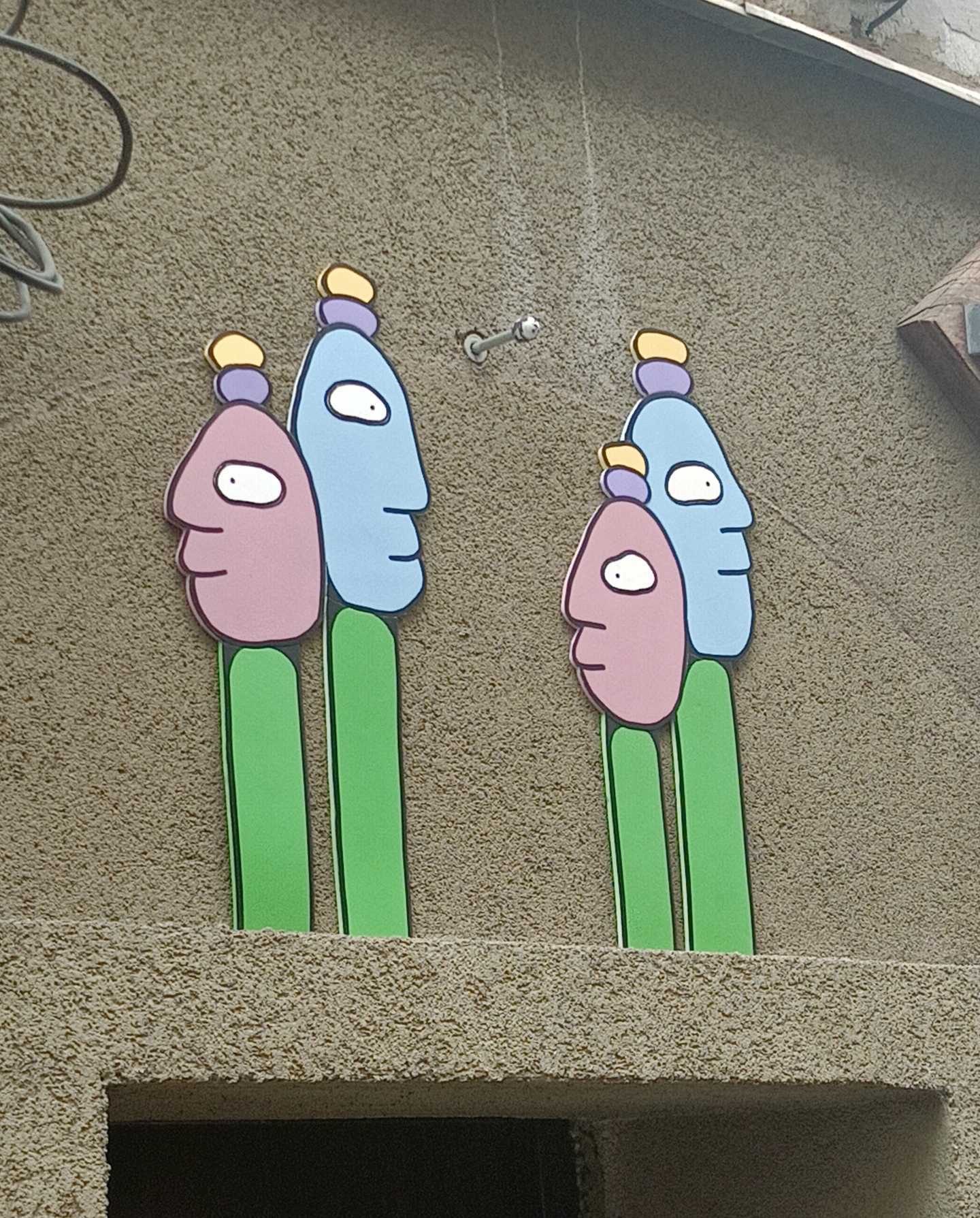 Duo of Naive Totemic Characters — Street art by Chinelo in Prague