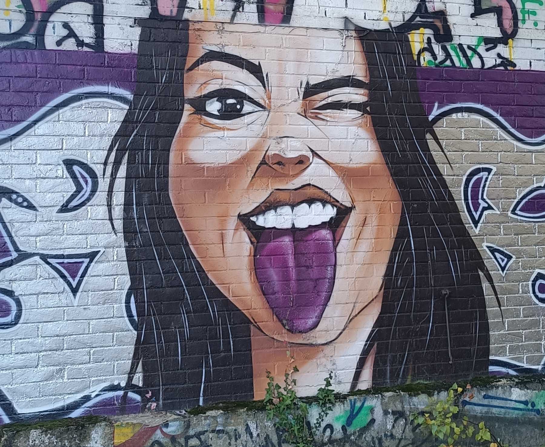 Woman Sticking Out Her Tongue — Street art in Rennes