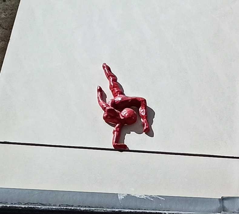 Red Acrobat Figurine in Paris — Street art in Paris