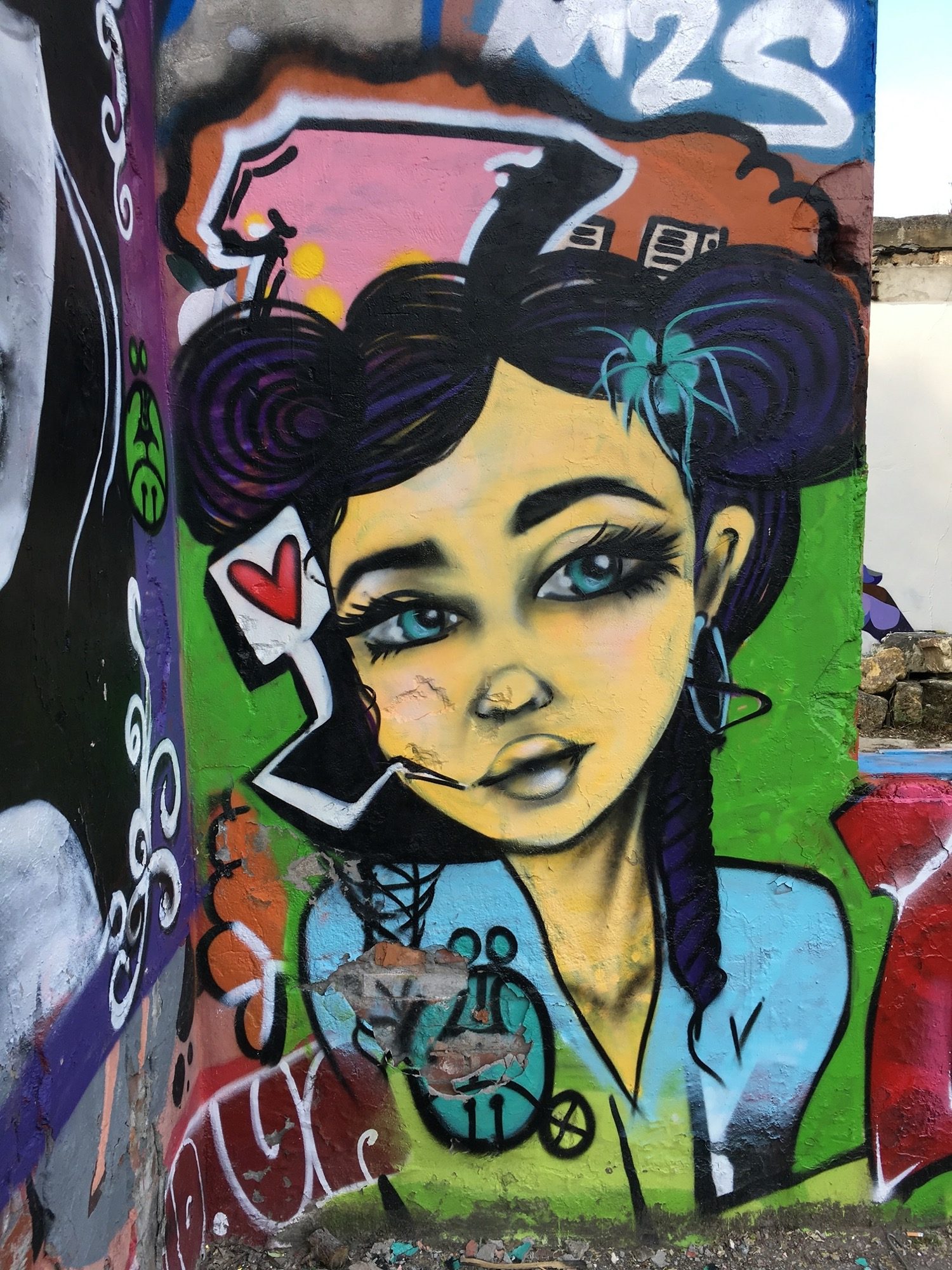 Girl with colorful pigtails — Street art in Bordeaux