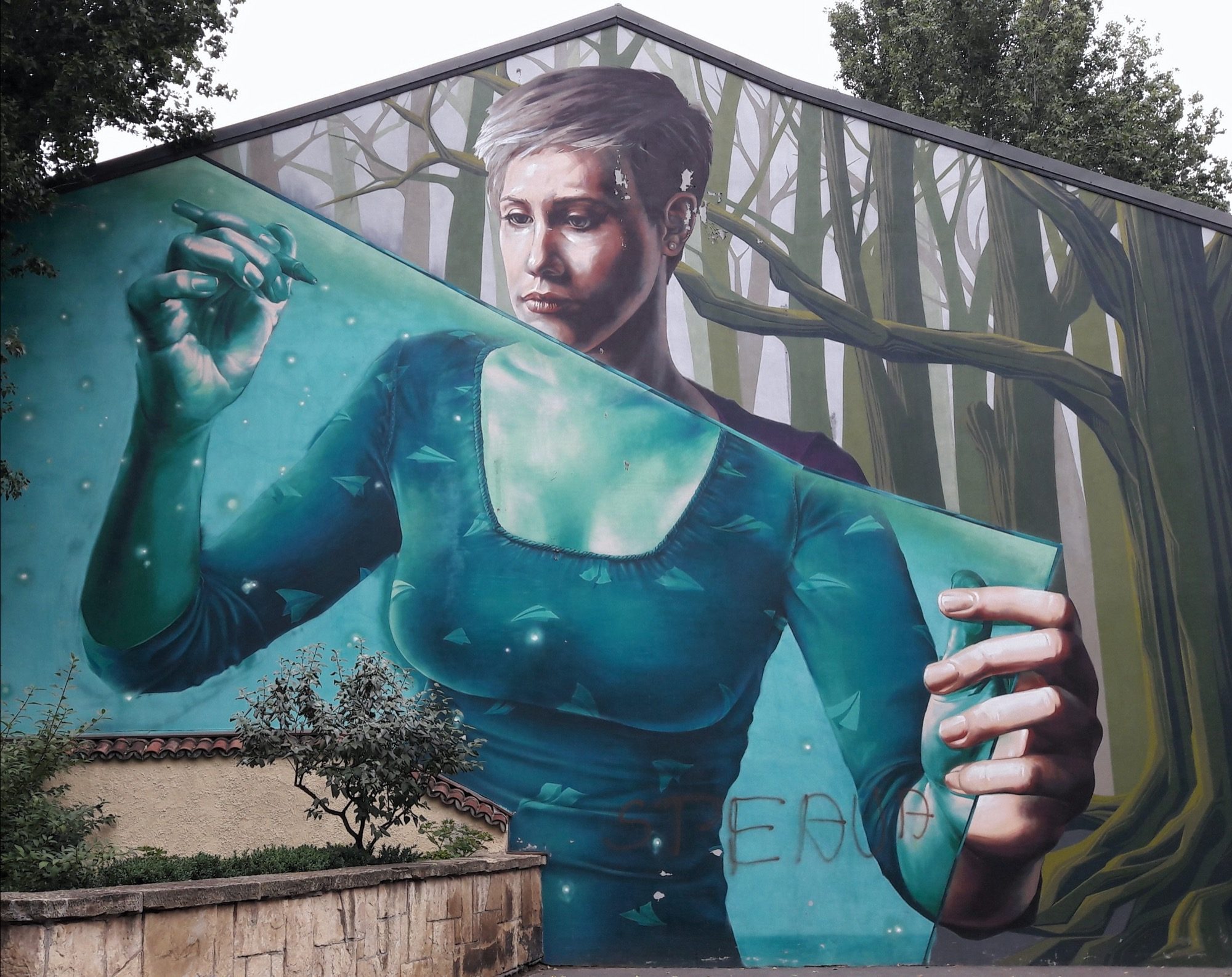 Woman in a Turquoise Dress before the Woods — Street art in Bucharest