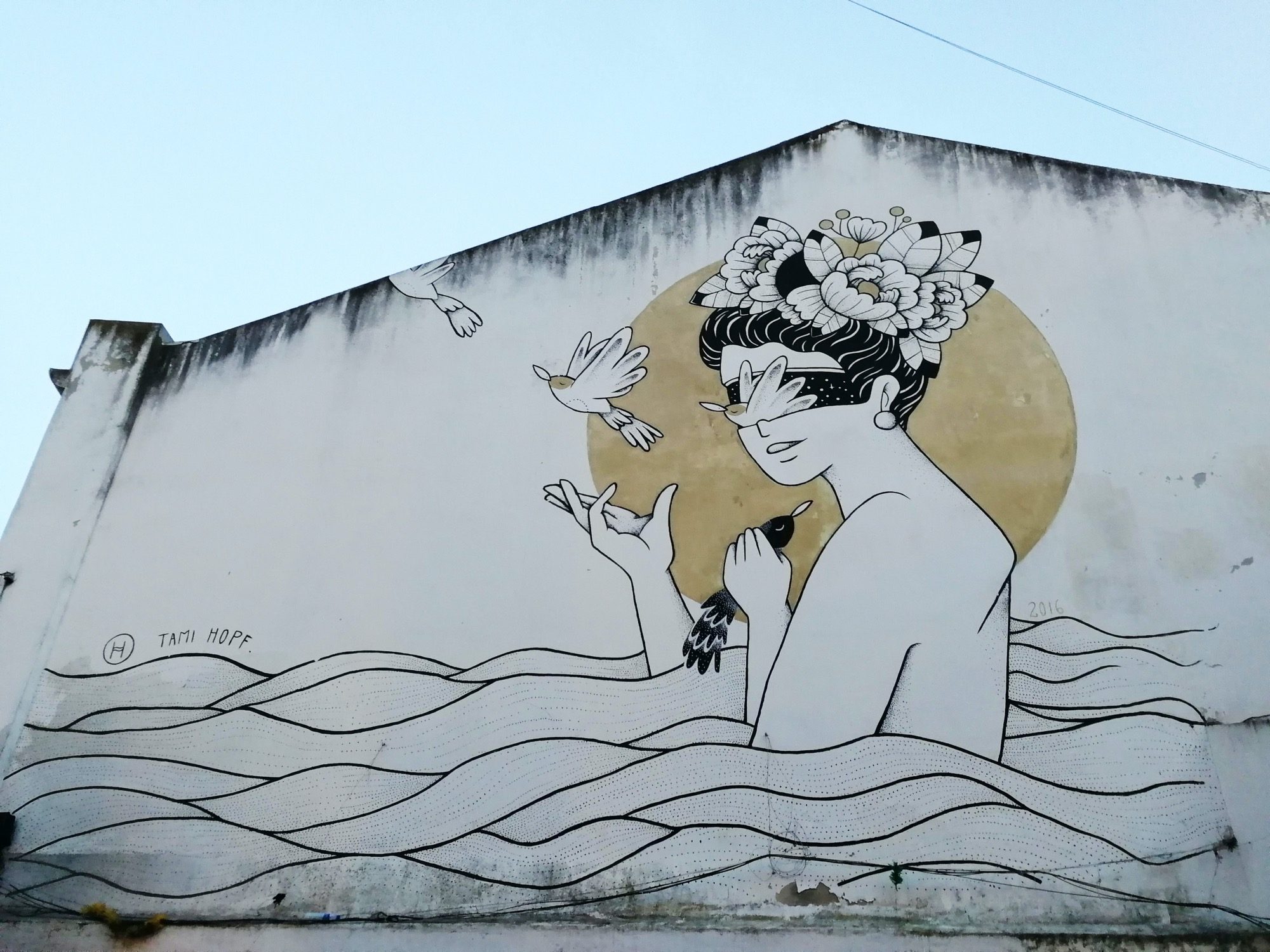 The Woman with Flowers and Birds, by Tami Hopf — Street art by Tami Hopf in Lisboa