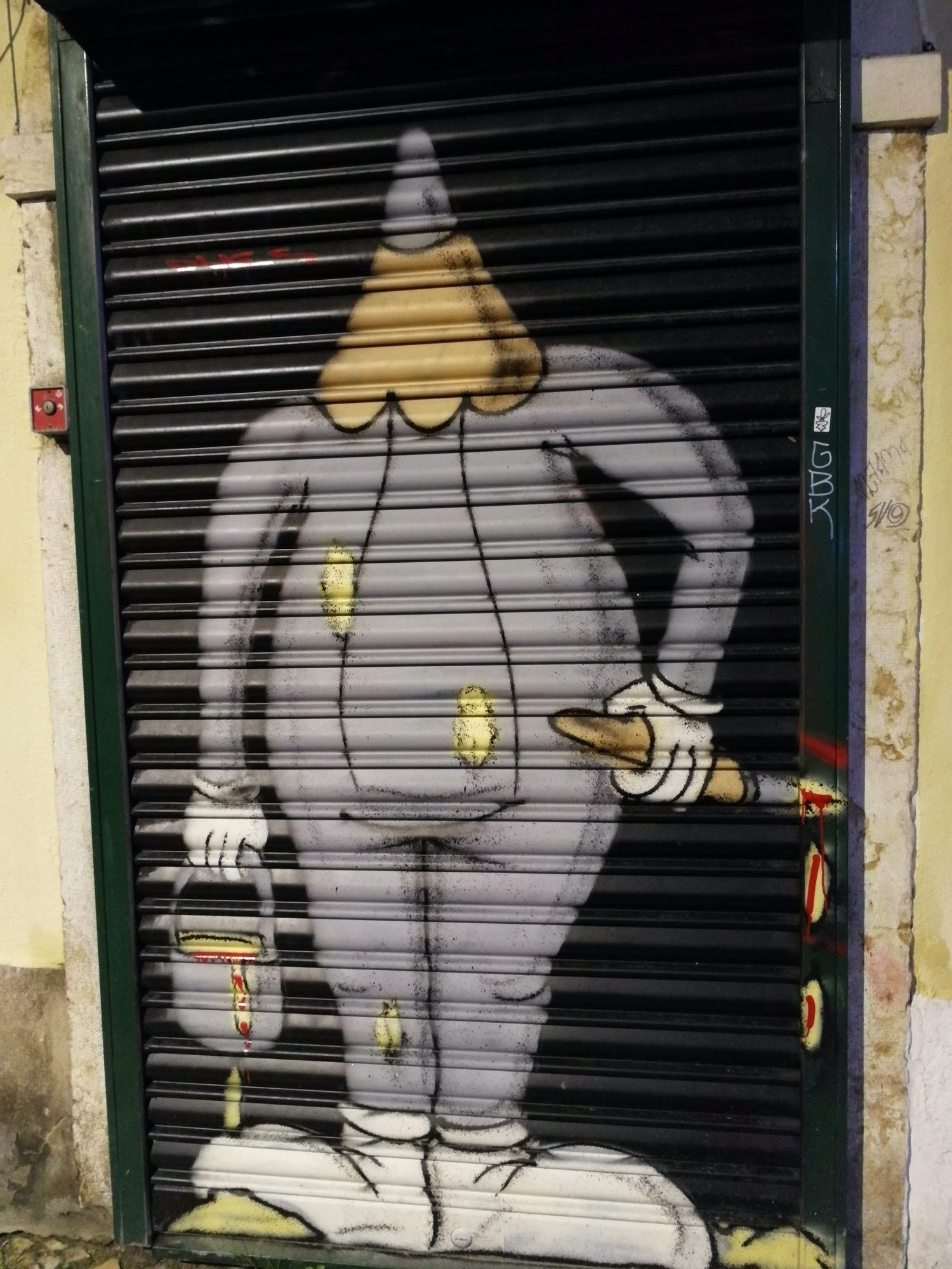 Pierrot Clown Stencil Metal Shutter Lisbon — Street art in Lisboa