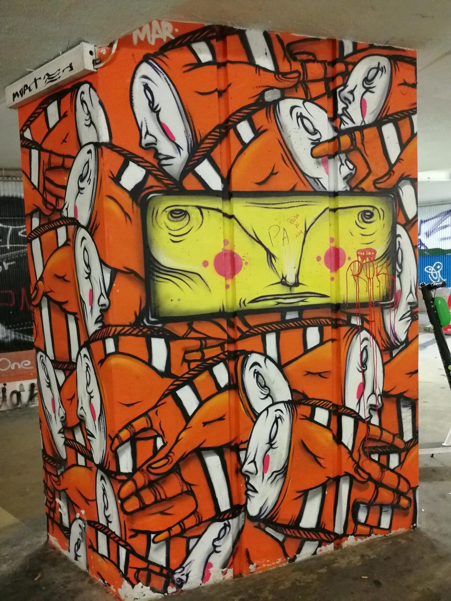 Repeated Profiles Orange Bridge Pillar — Street art in Lisboa