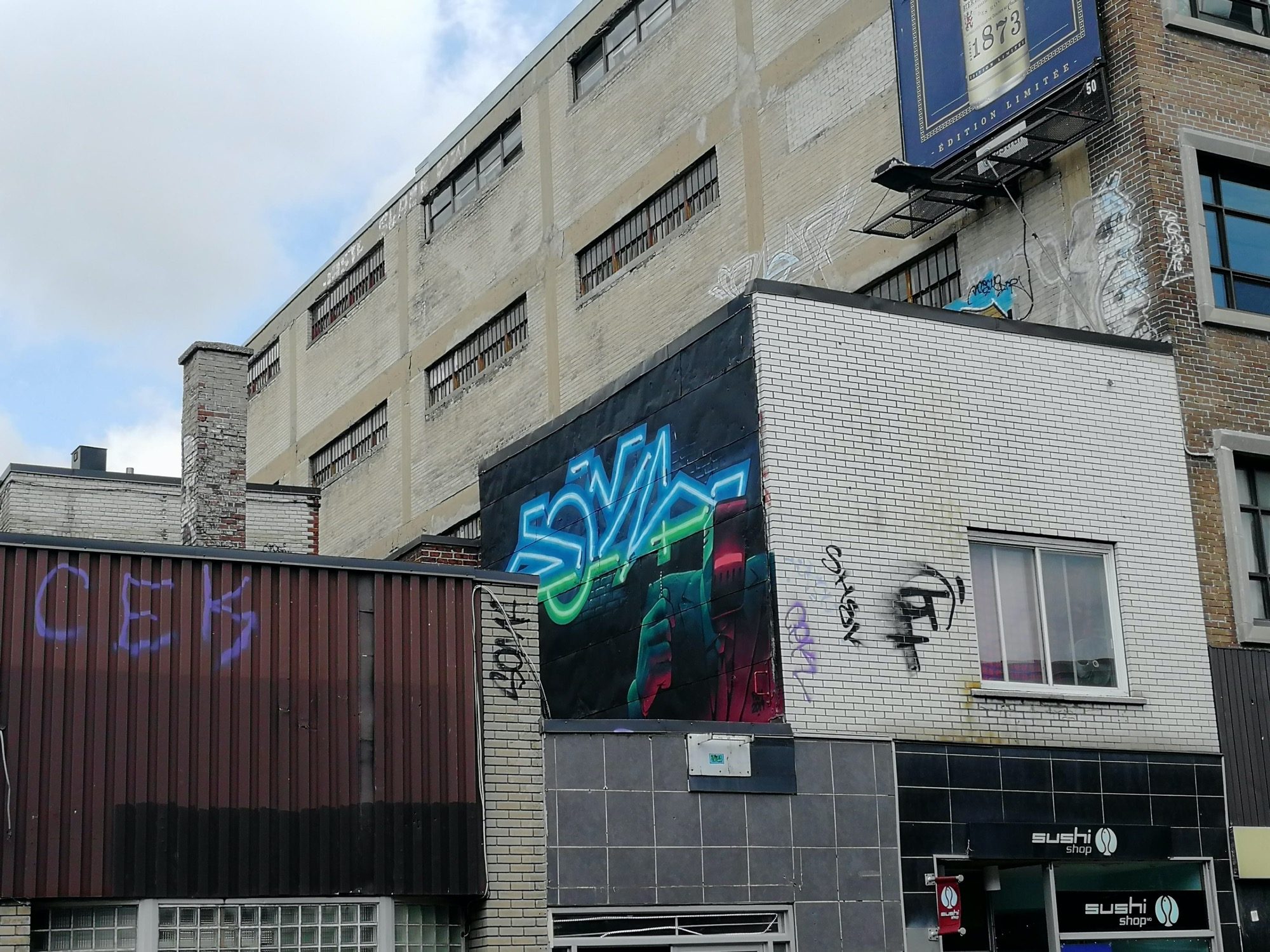 Neon Letters on Urban Wall — Street art in Montréal