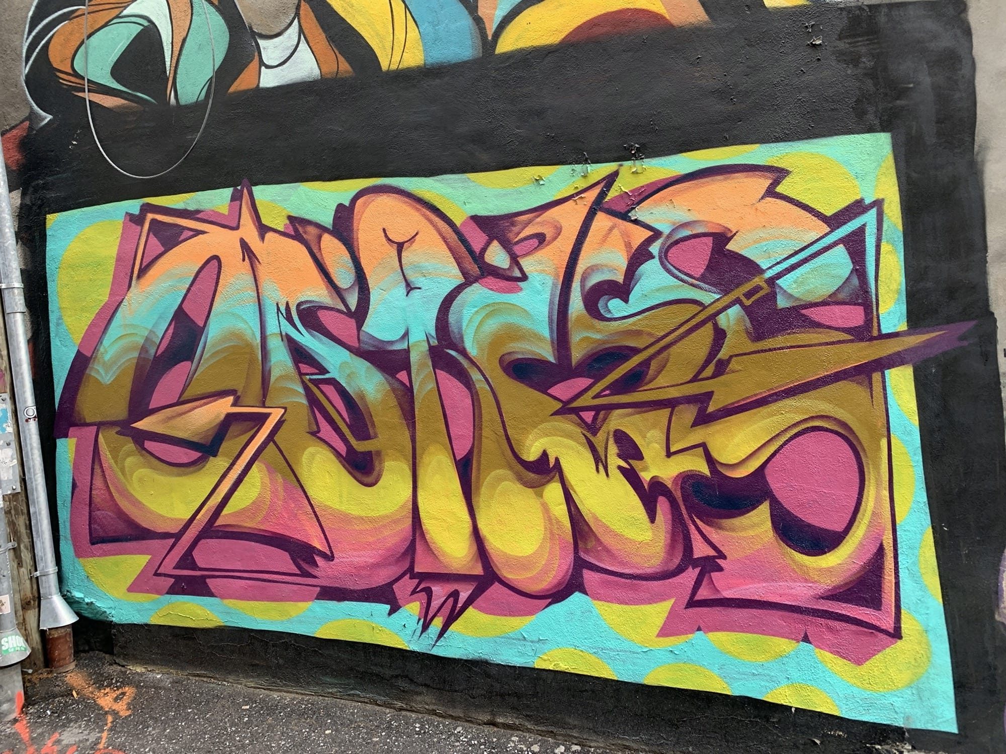 Yellow and Pink Wildstyle on Black — Street art in Montréal