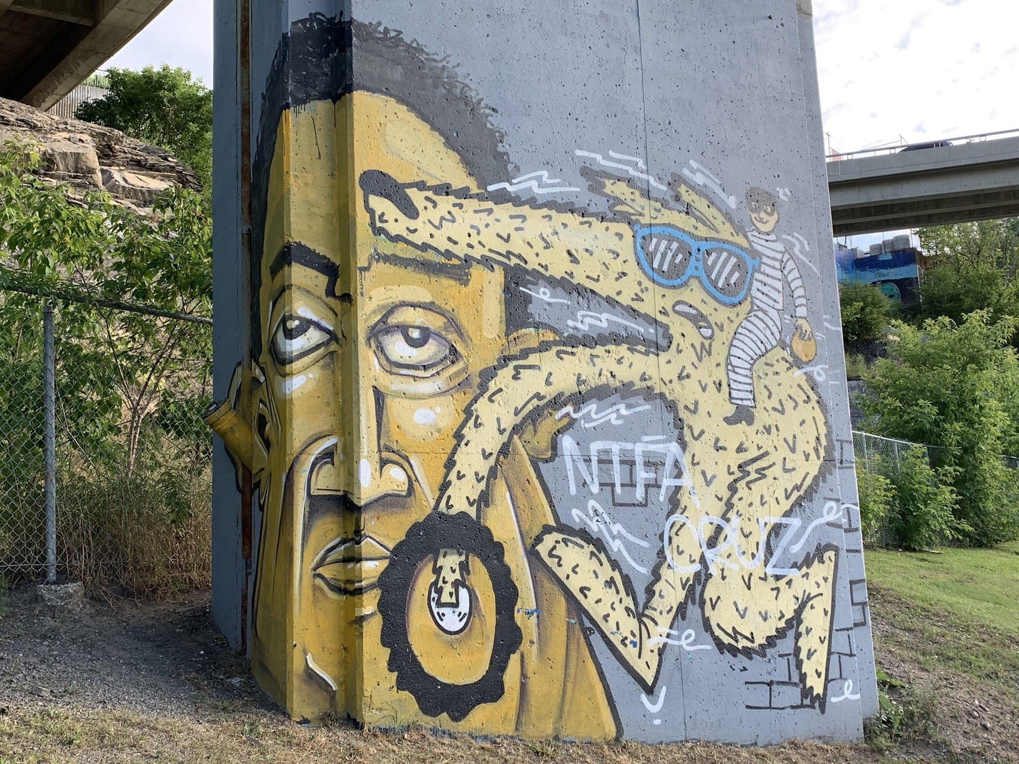 Yellow Portrait Under the Bridge — Street art in Québec
