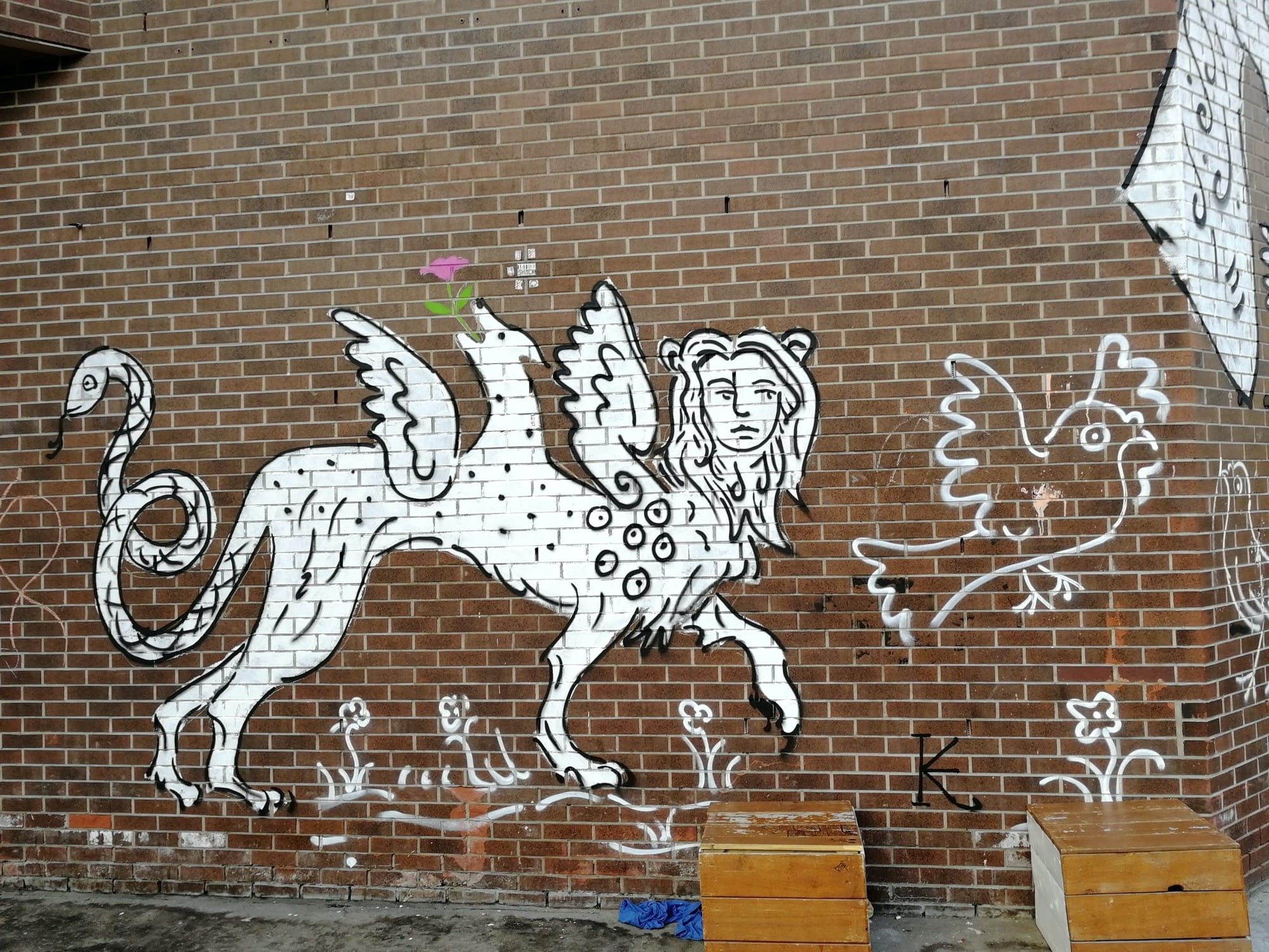 Winged Griffin and Rooster in White Lines — Street art in Québec