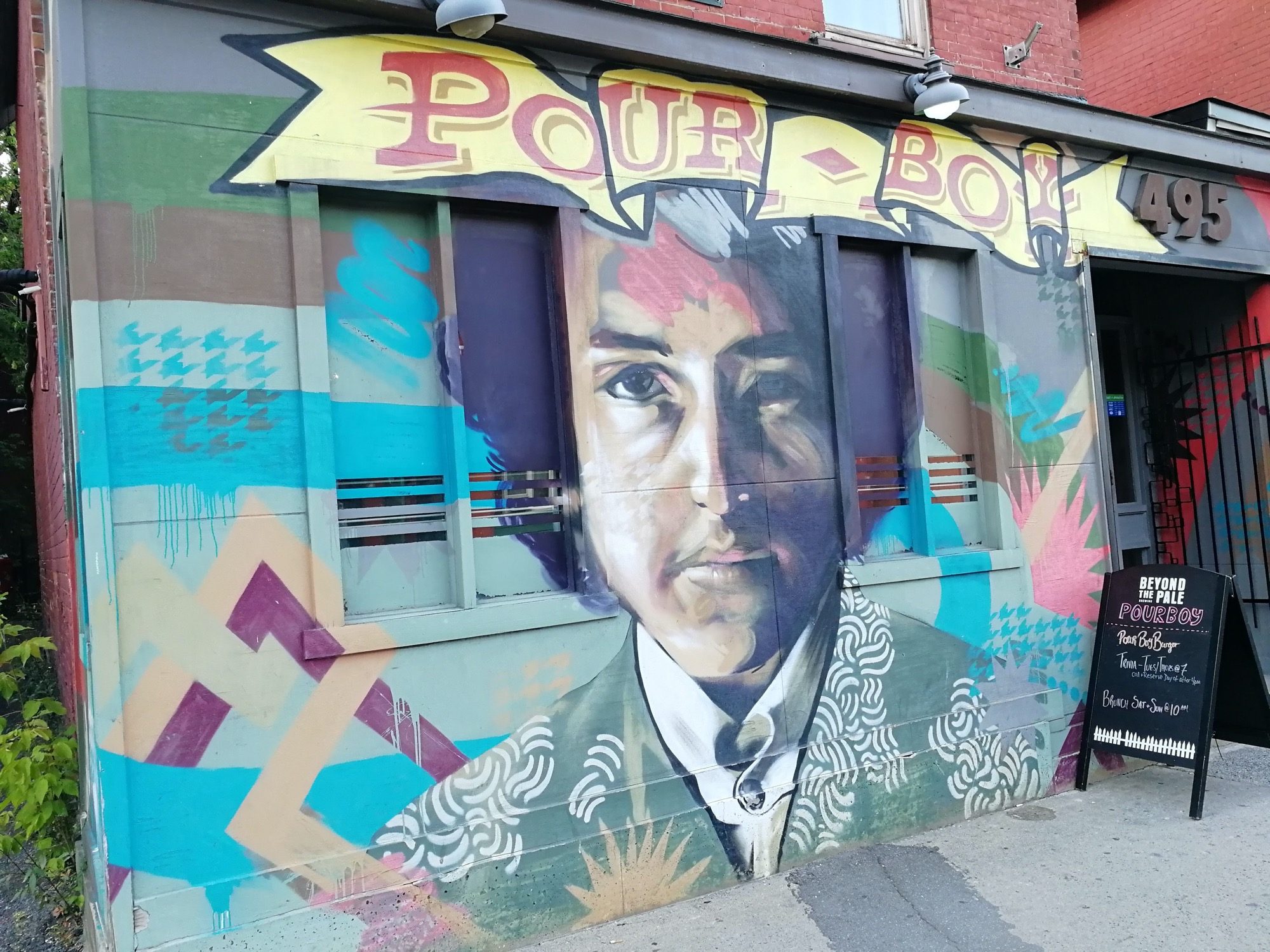 Portrait under the Pour Boy Sign — Street art in Ottawa