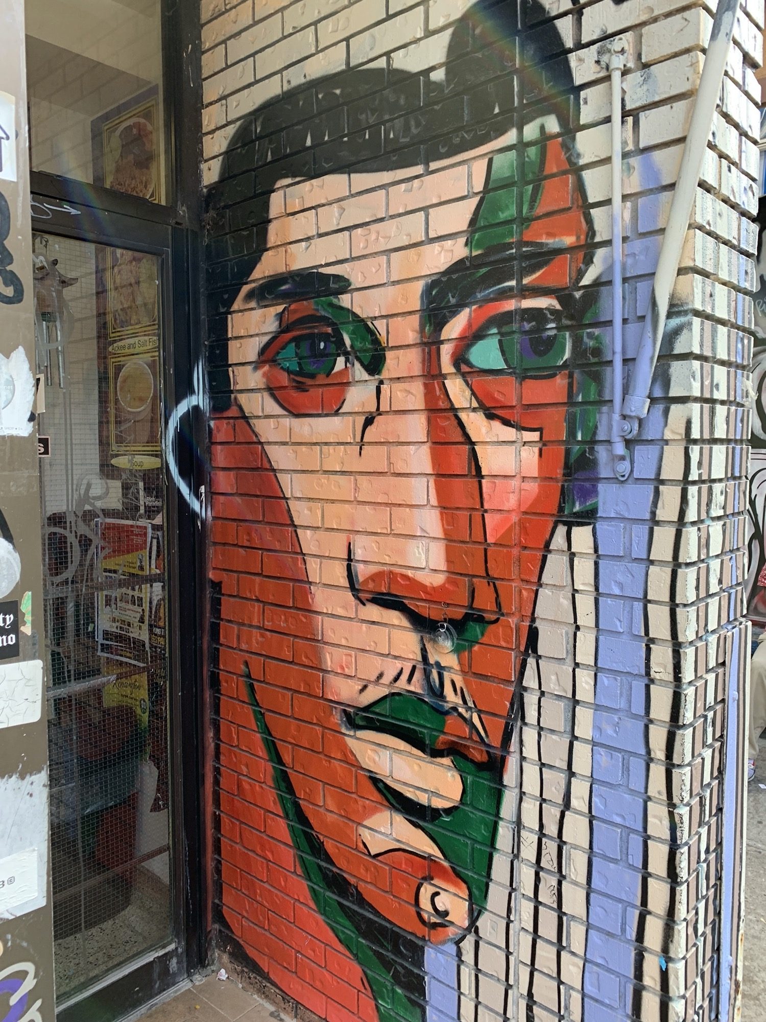 Expressive Portrait on Baldwin Facade — Street art in Toronto