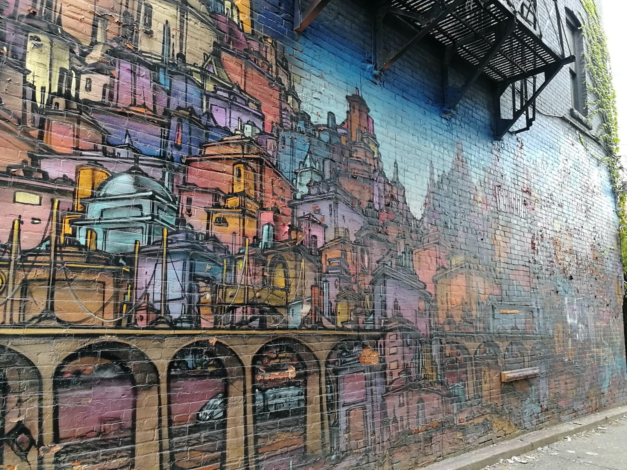 European City Panorama on Brick Wall — Street art in Toronto