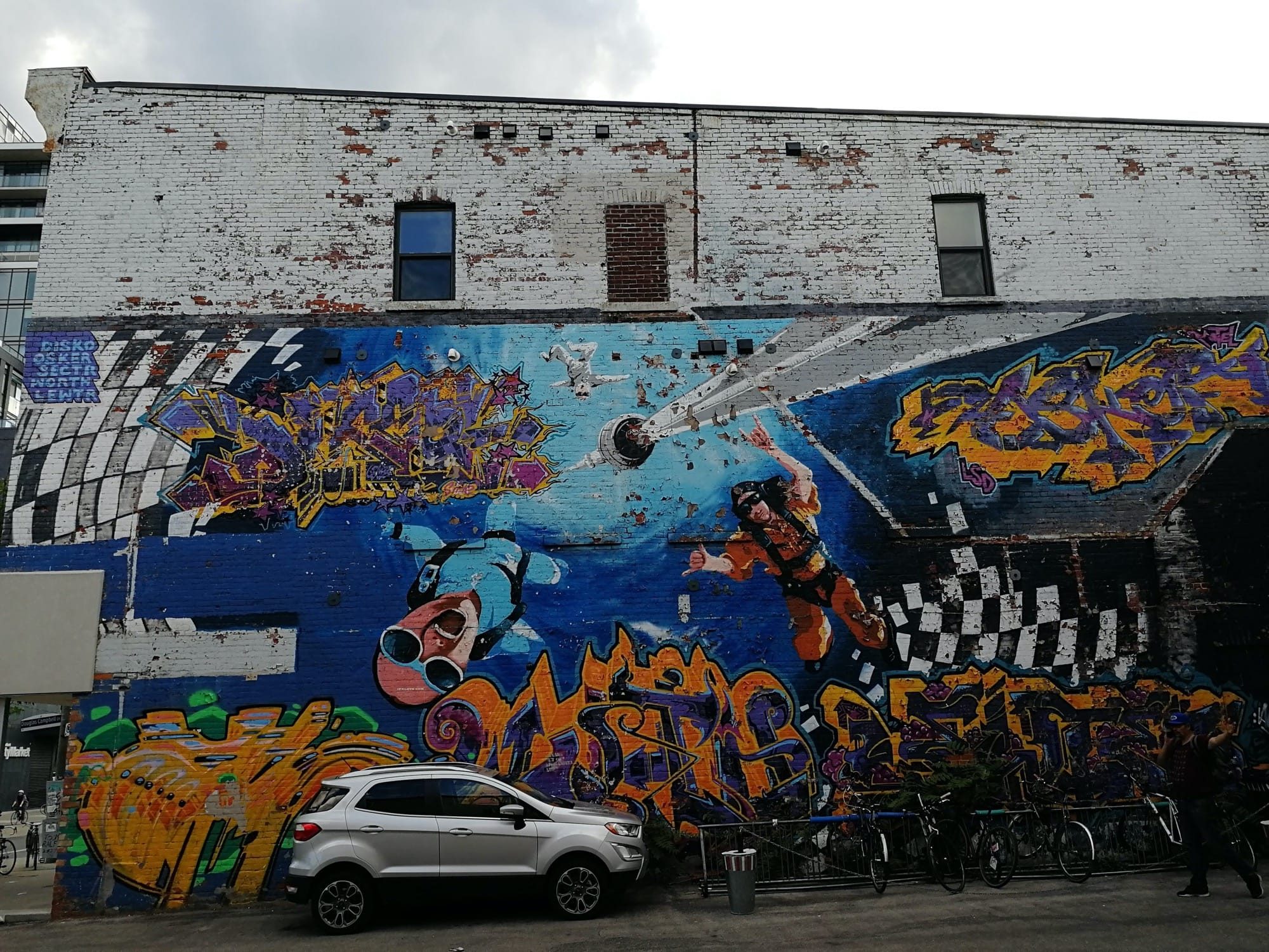 Astronauts in Space Mural College Street — Street art in Toronto