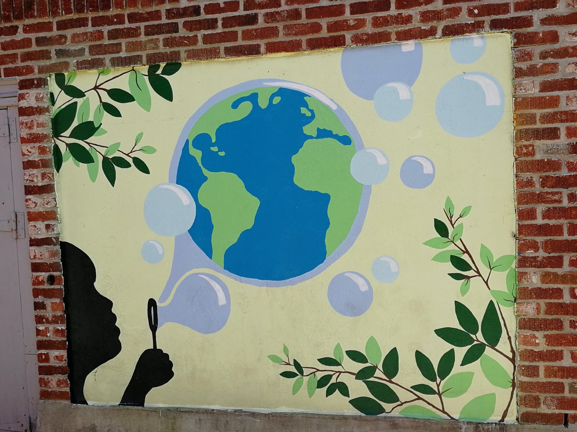 L'enfant qui souffle la Terre — Street art à Montréal
