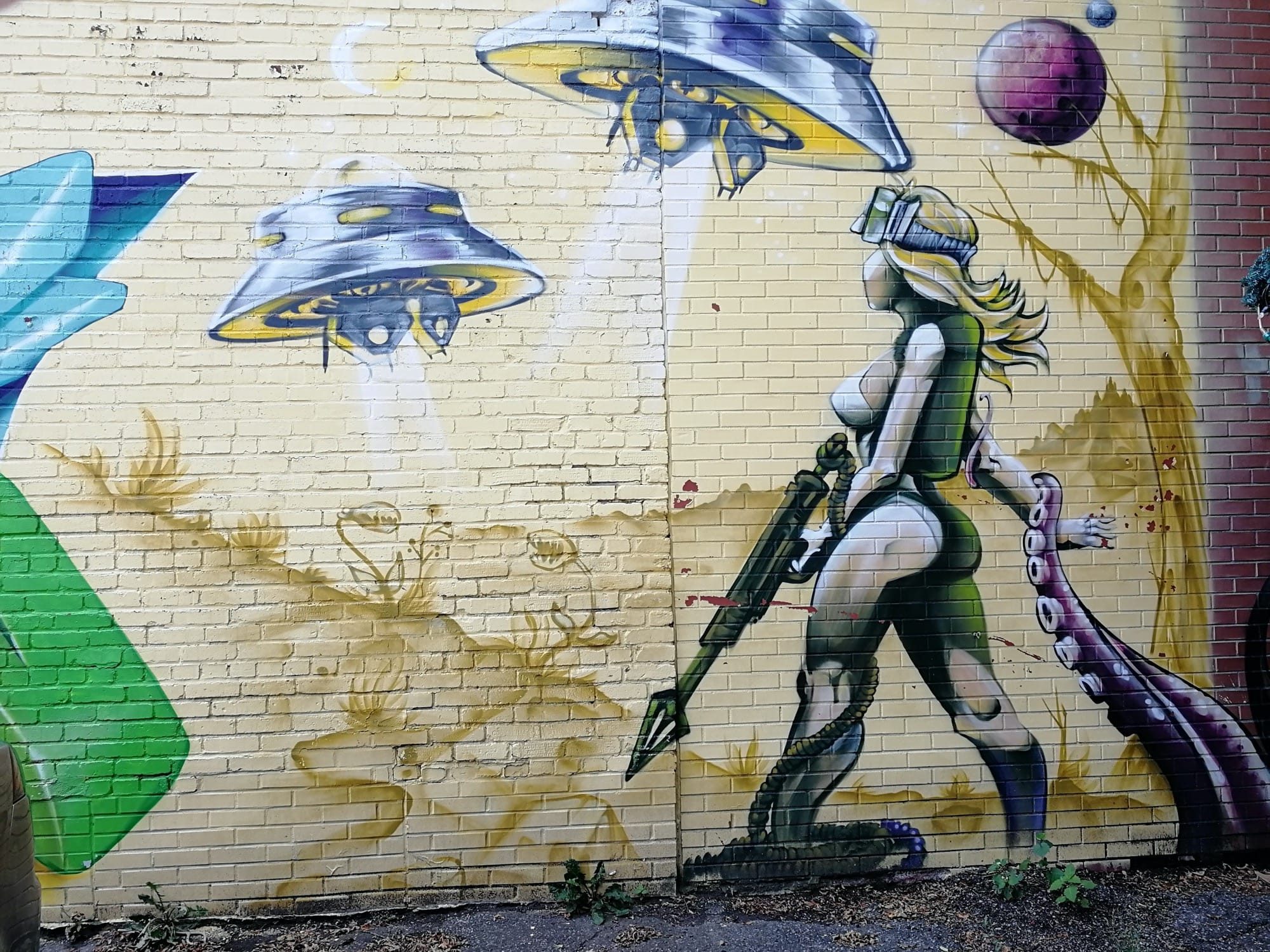 The Fighter and the Flying Saucers — Street art in Montréal