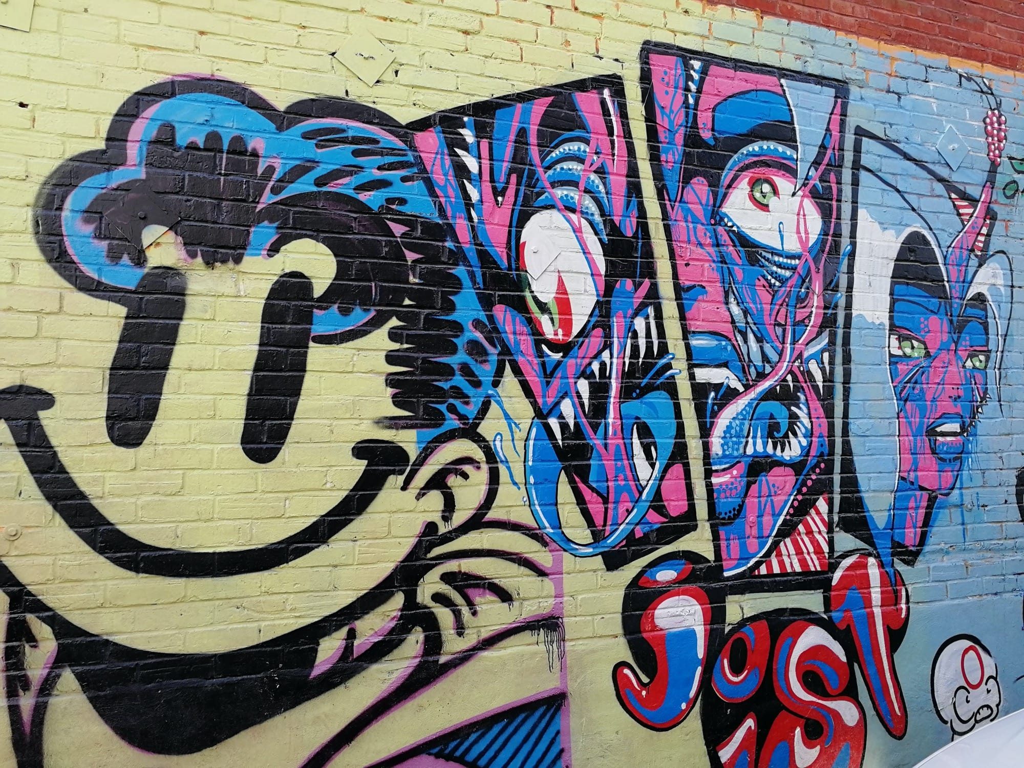 The Black Laugher and the Psychedelic Faces — Street art in Montréal