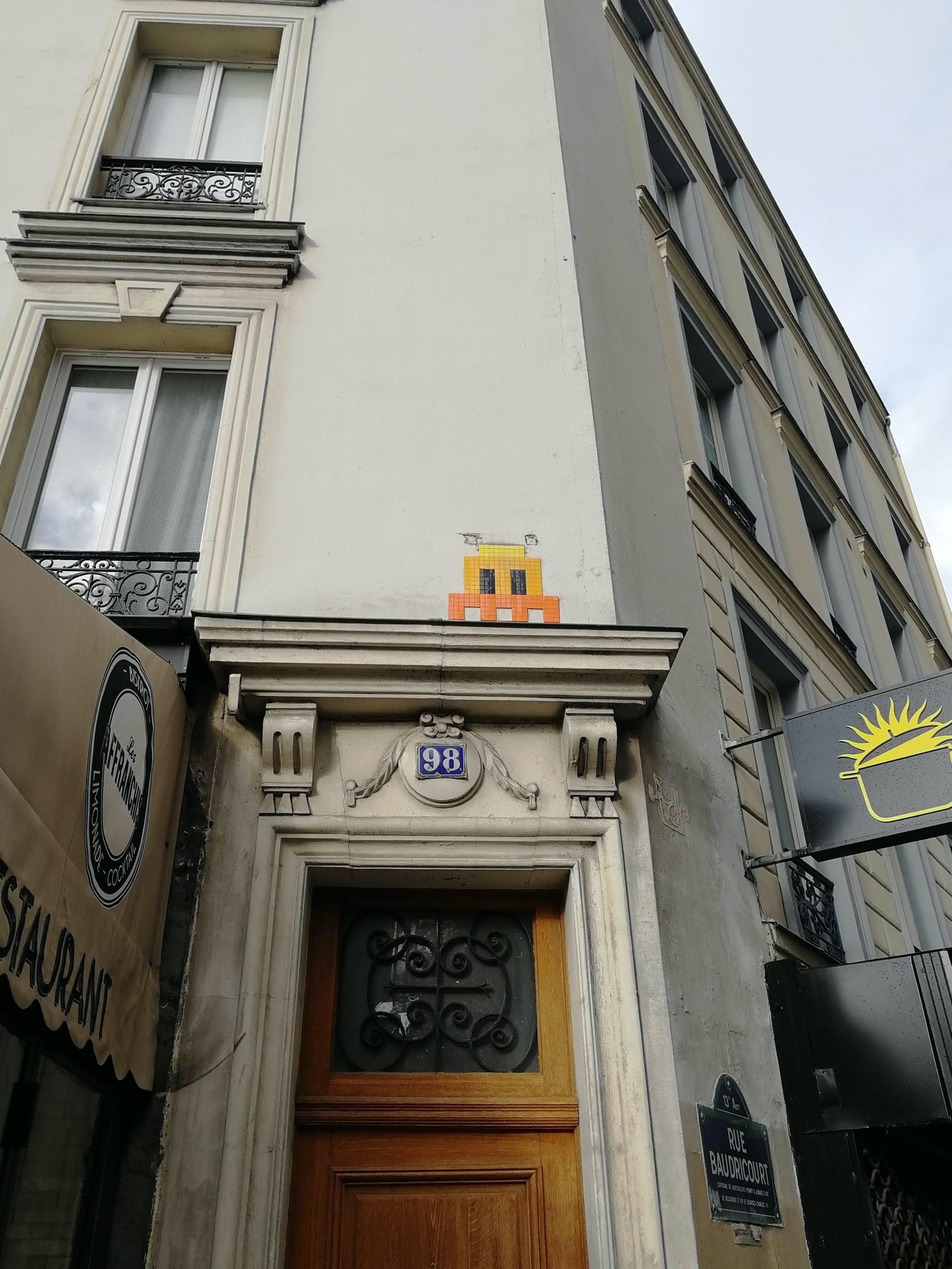 PA_1108, Orange Space Invader on Rue de Tolbiac — Street art by Invader in Paris