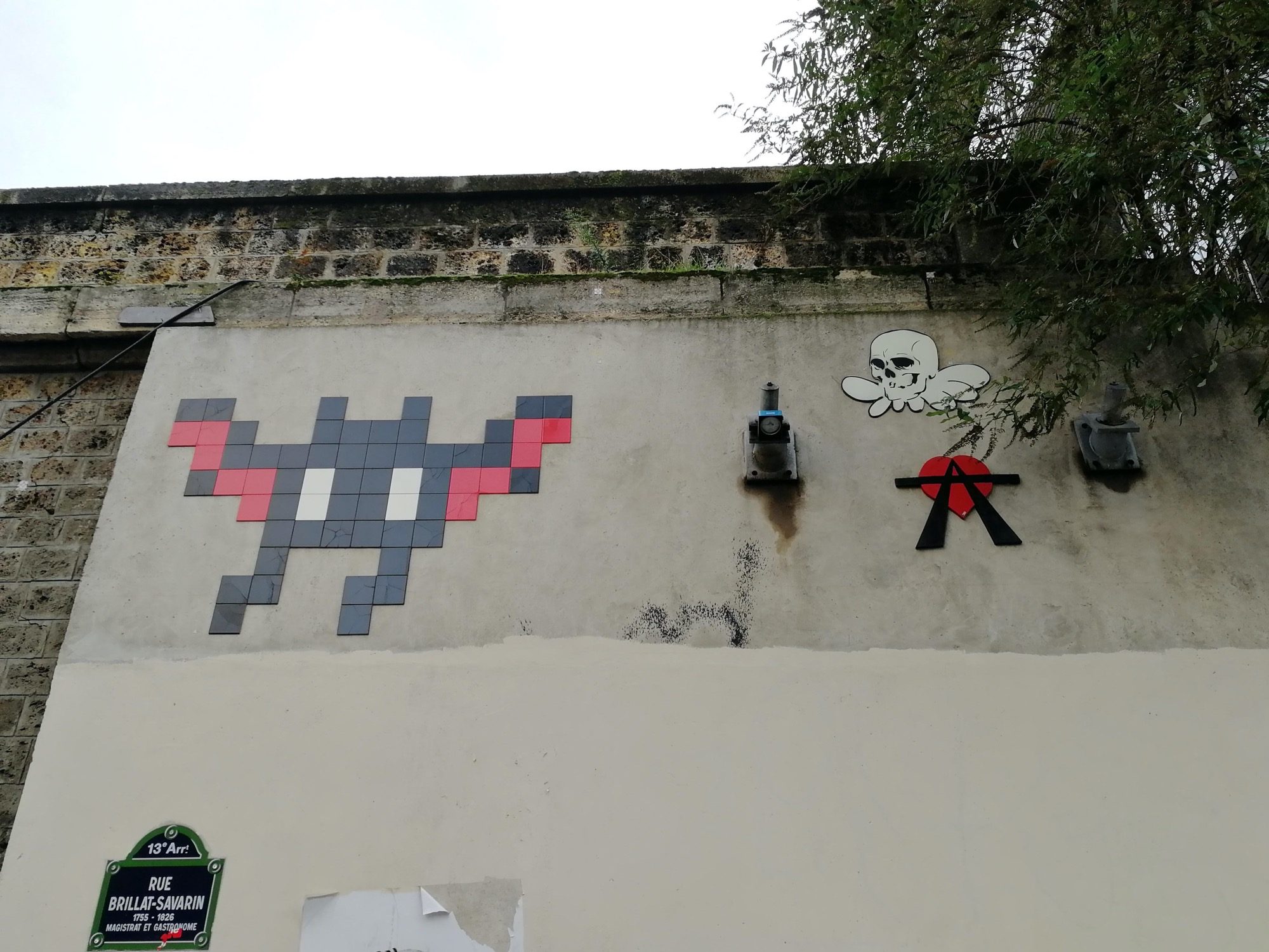 Mosaic and Skull by A2 — Street art by Invader, A2, Gzup in Paris