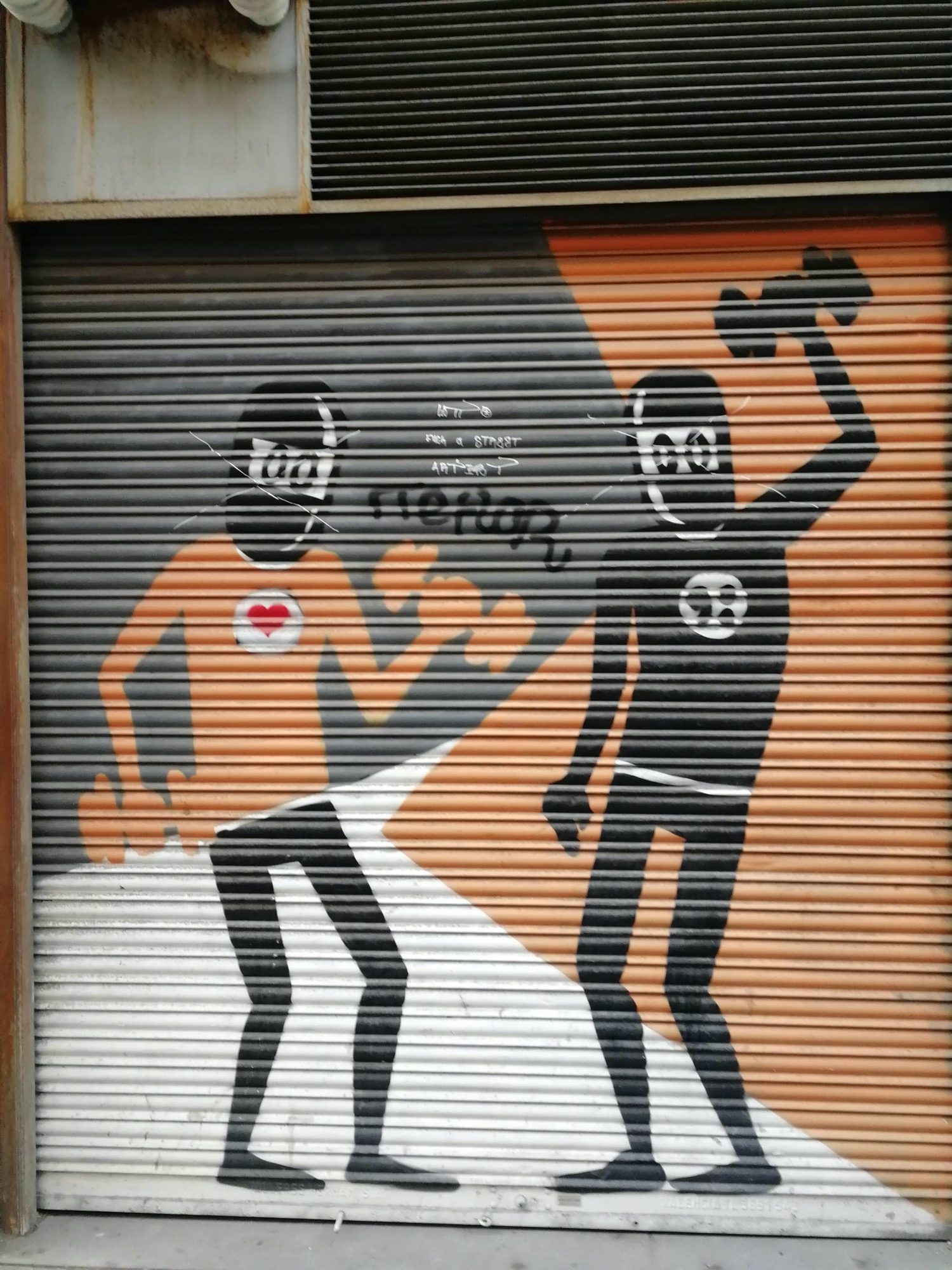 Duo of Characters on Orange and Grey Shutter — Street art by David de Limon in València