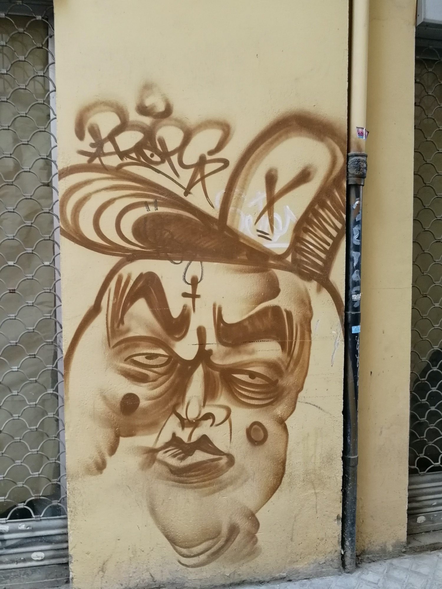 Ochre Face Marked with an Ankh — Street art in València