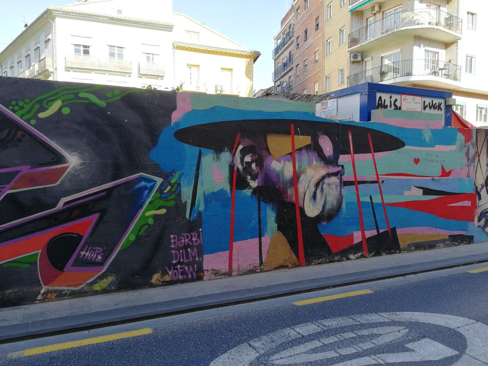 Collective Wall with Large Hat Character — Street art in València
