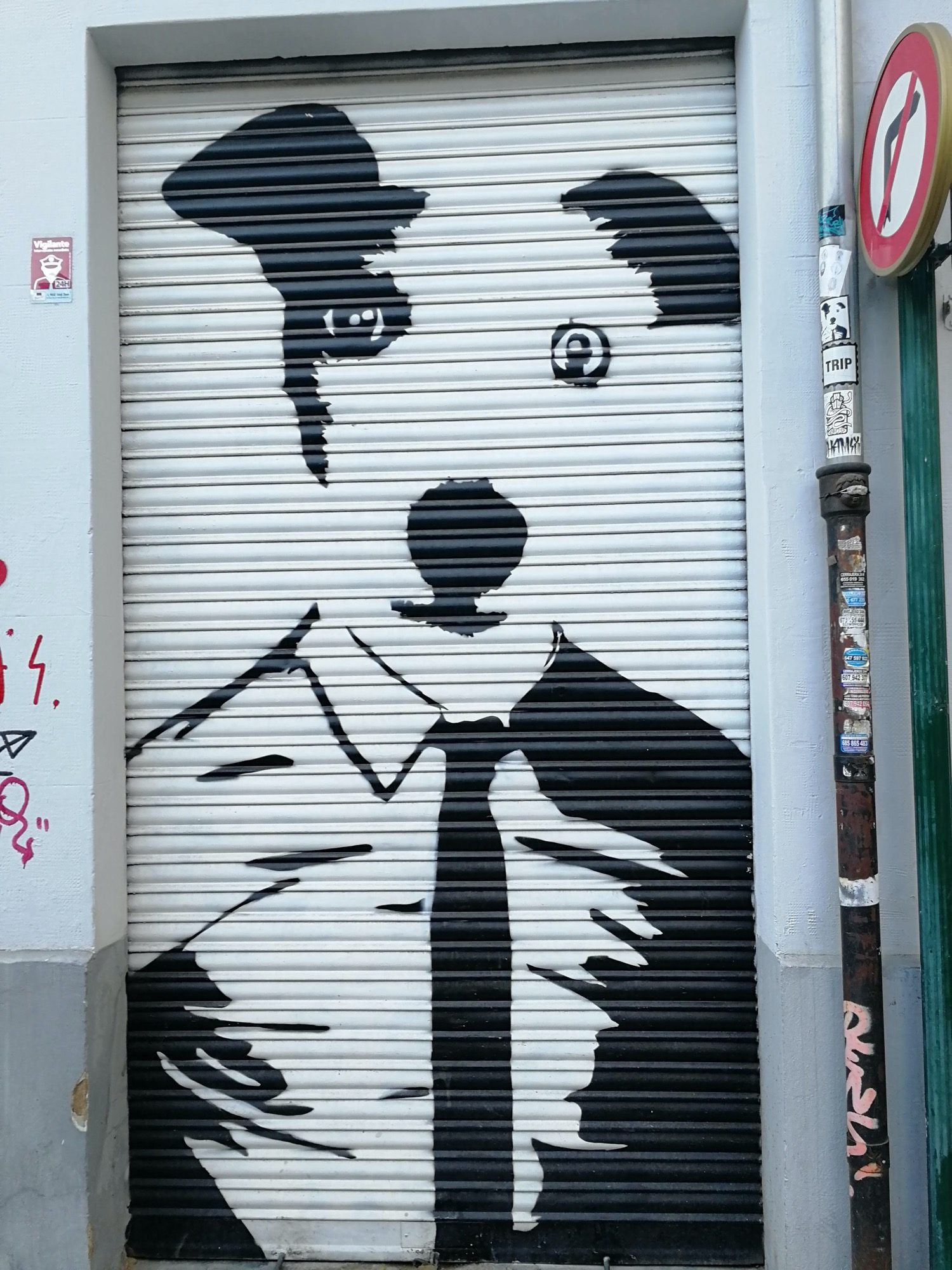 Dog in Suit on White Shutter - Bowy — Street art by Bowy in València