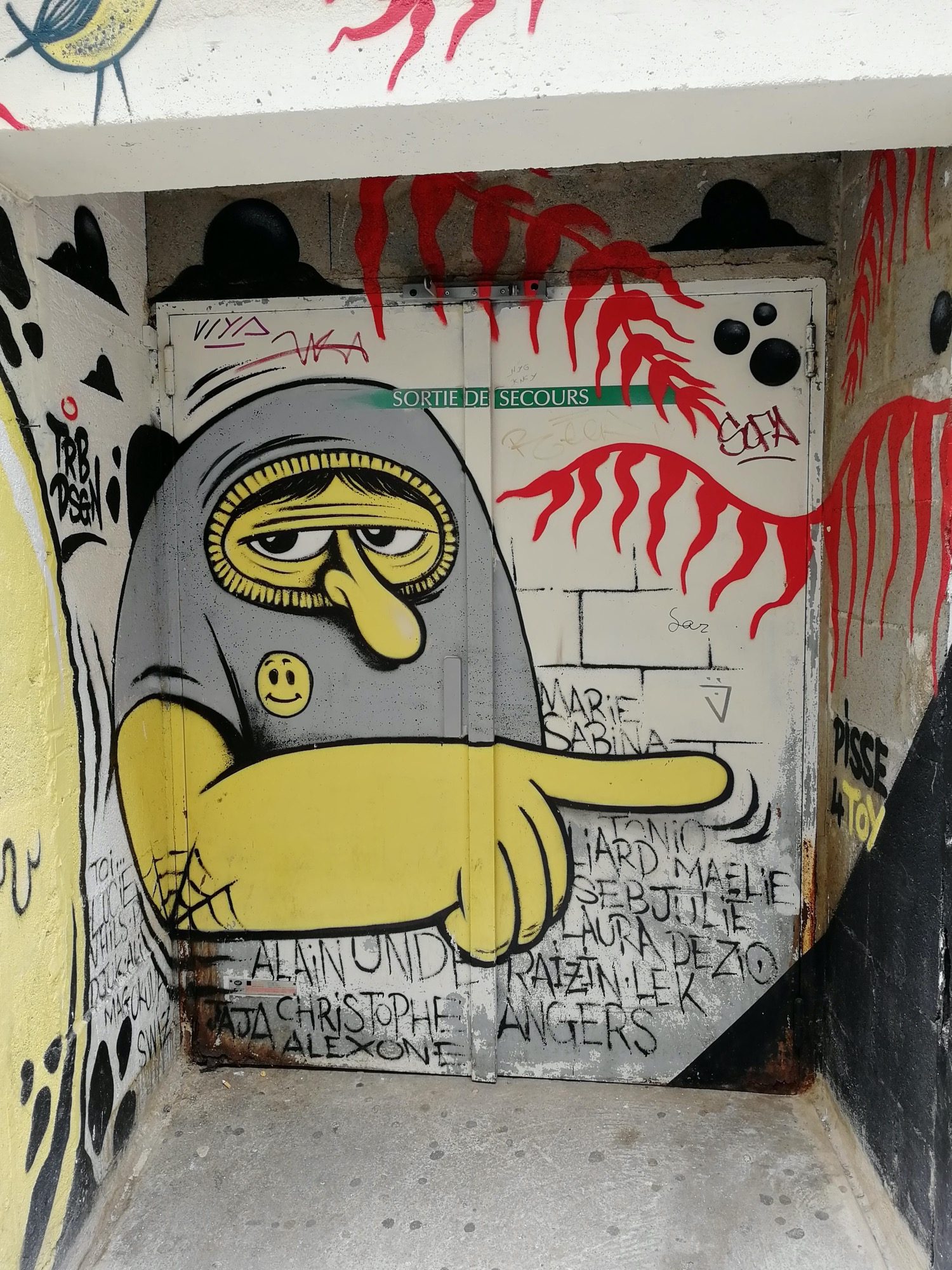 The Masked Figure Pointing — Street art in Angers