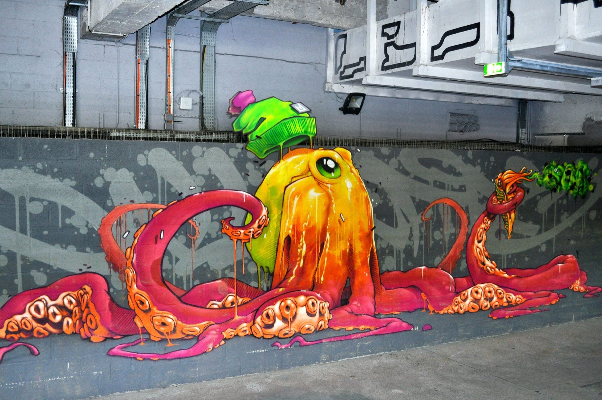 Giant Octopus in a Green Cap — Street art by Kalouf in Paris