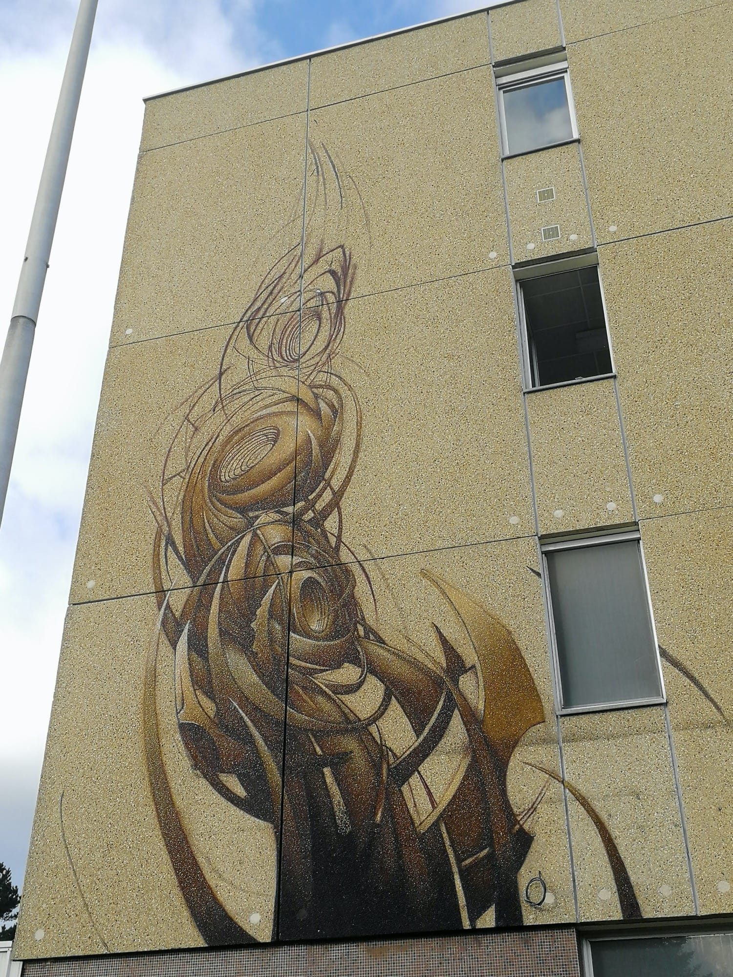 Rea One's Ochre Spiral — Street art by Rea One in Ploufragan