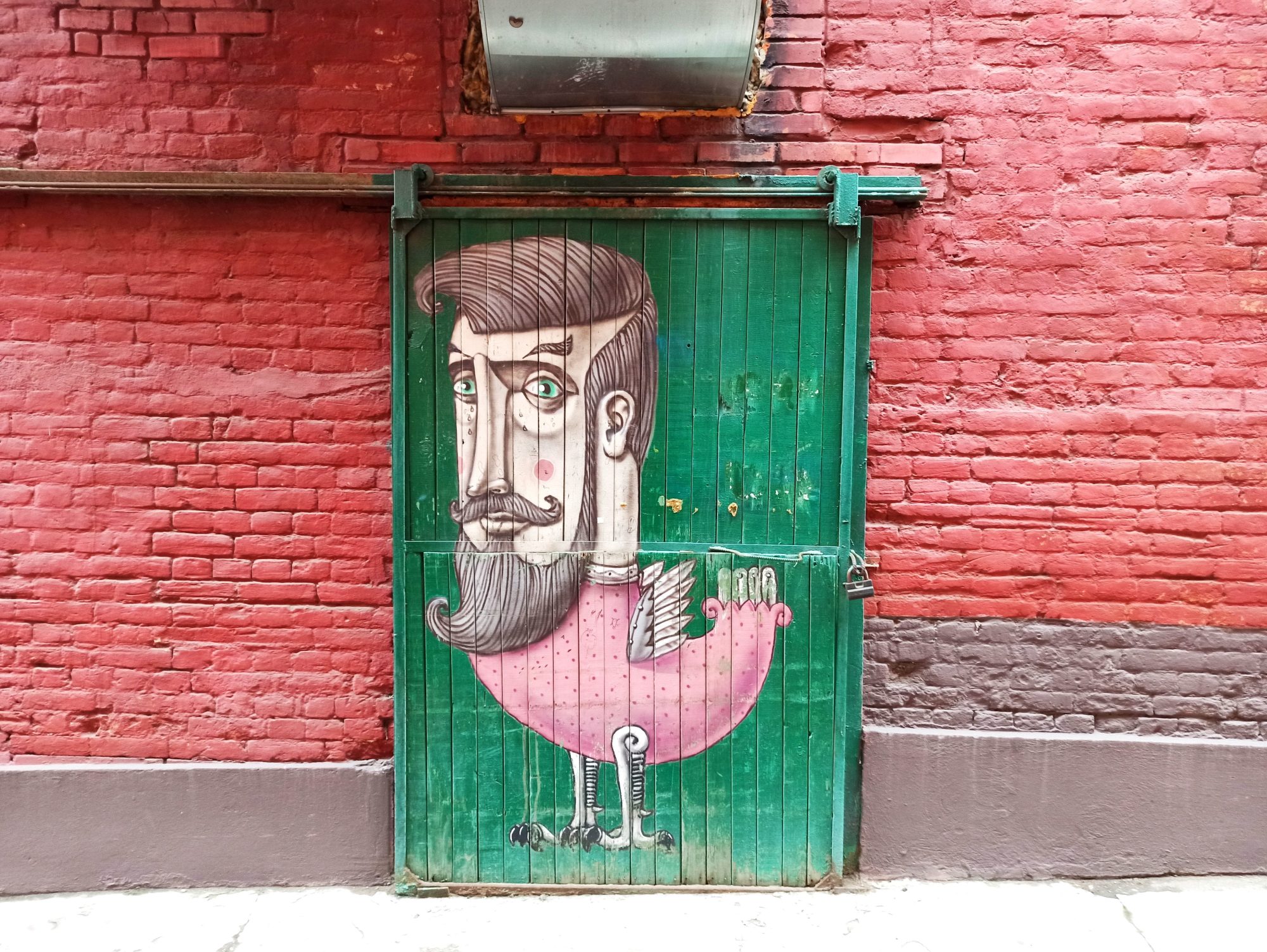 Bird-Man on a Green Door — Street art by Kislow in Moskva