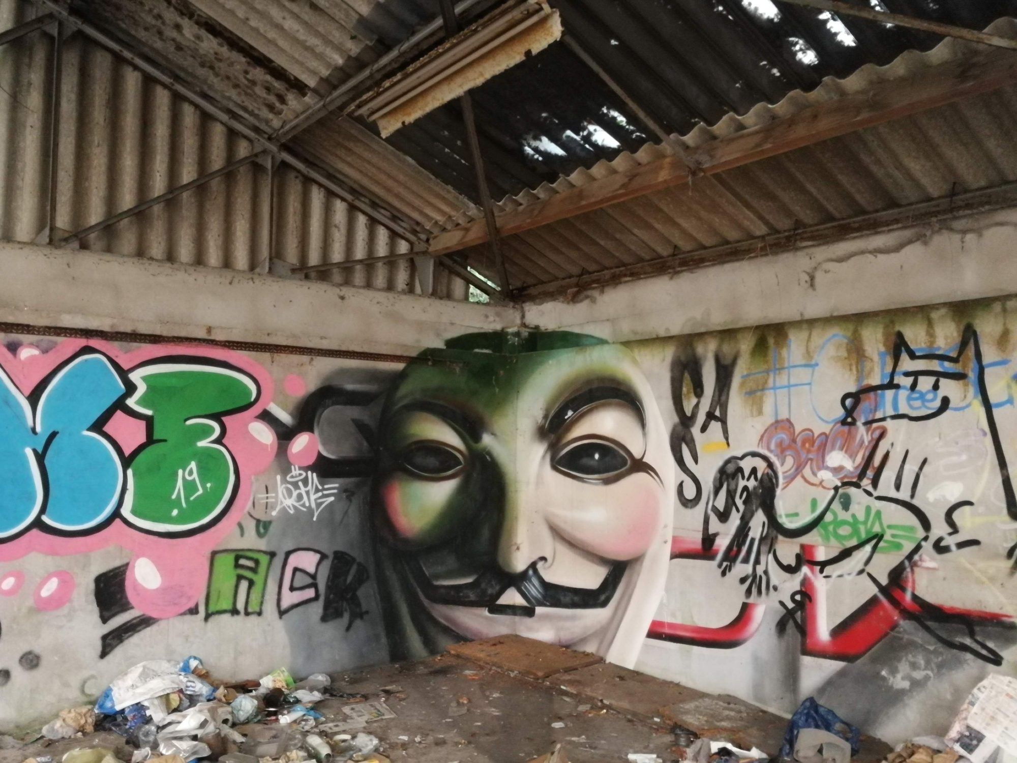 Anonymous Mask in an Abandoned Spot — Street art in Morlaix