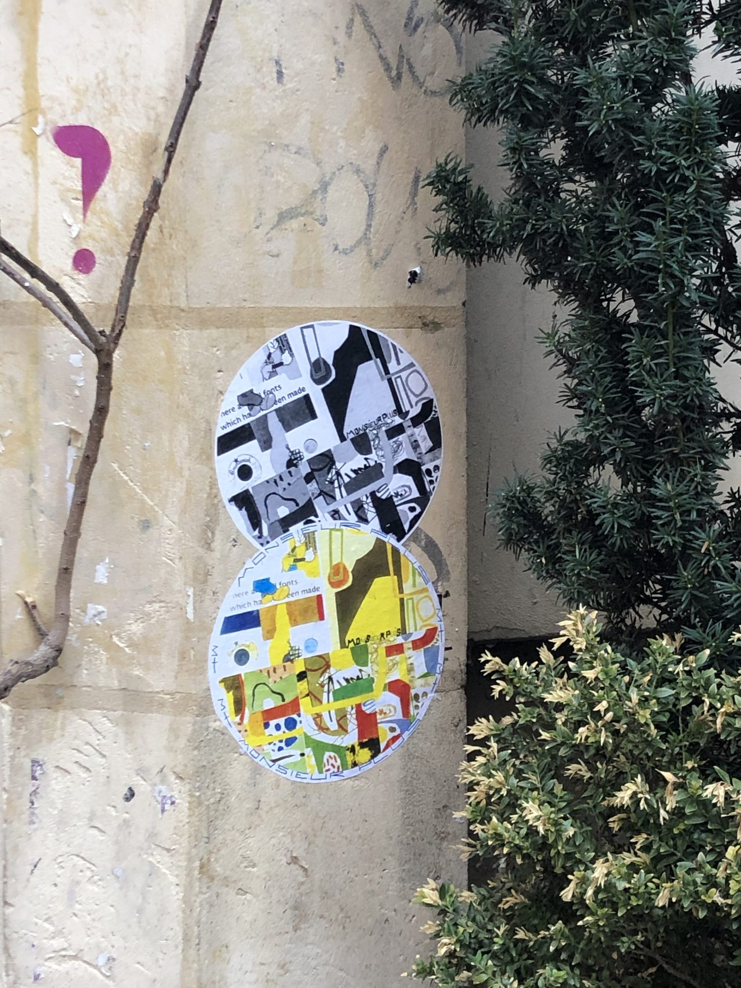 Two circular paste-ups on rue Rambuteau — Street art by Monsieur plus in Paris